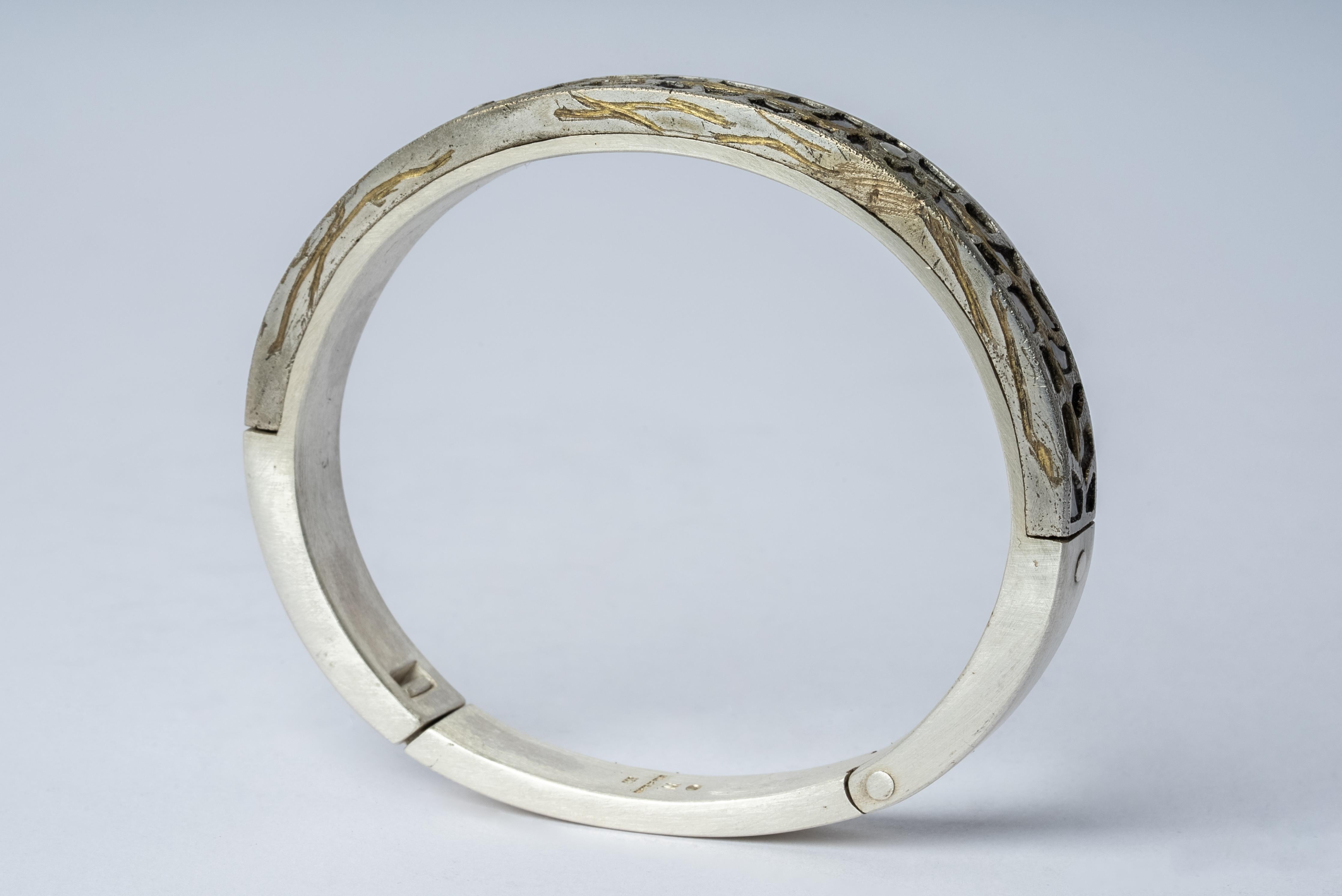 Bracelet in sterling silver, burned gold plated brass and slabs of rough diamond set in mega pave setting. These slabs are removed from a larger chunk of diamond. This item is made with a naturally occurring element and will vary from the photograph