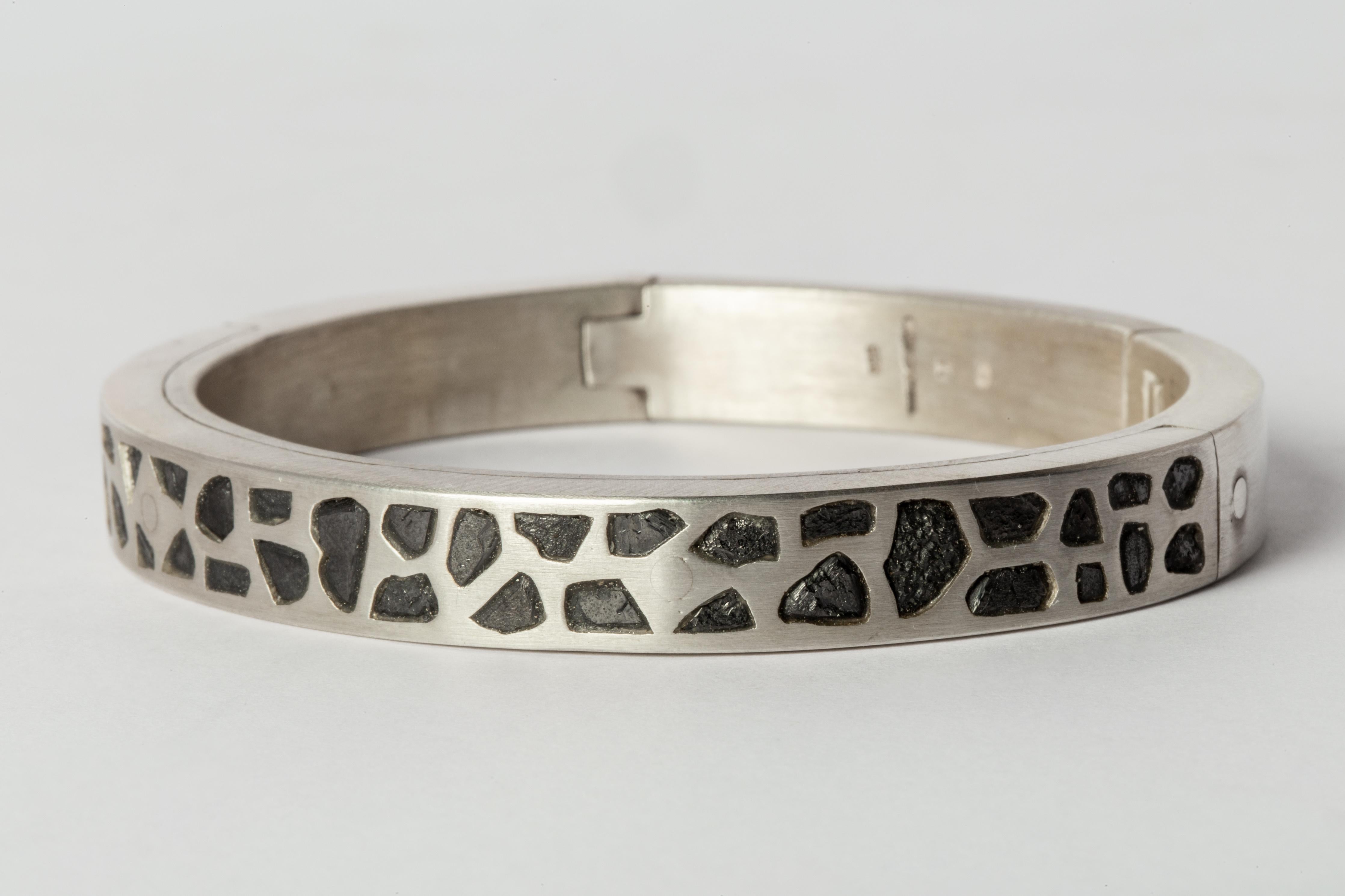 Bracelet in sterling silver and slabs of rough black diamond fragment set in mega pave setting. These slabs are removed from a larger chunk of diamond. This item is made with a naturally occurring element and will vary from the photograph you see.