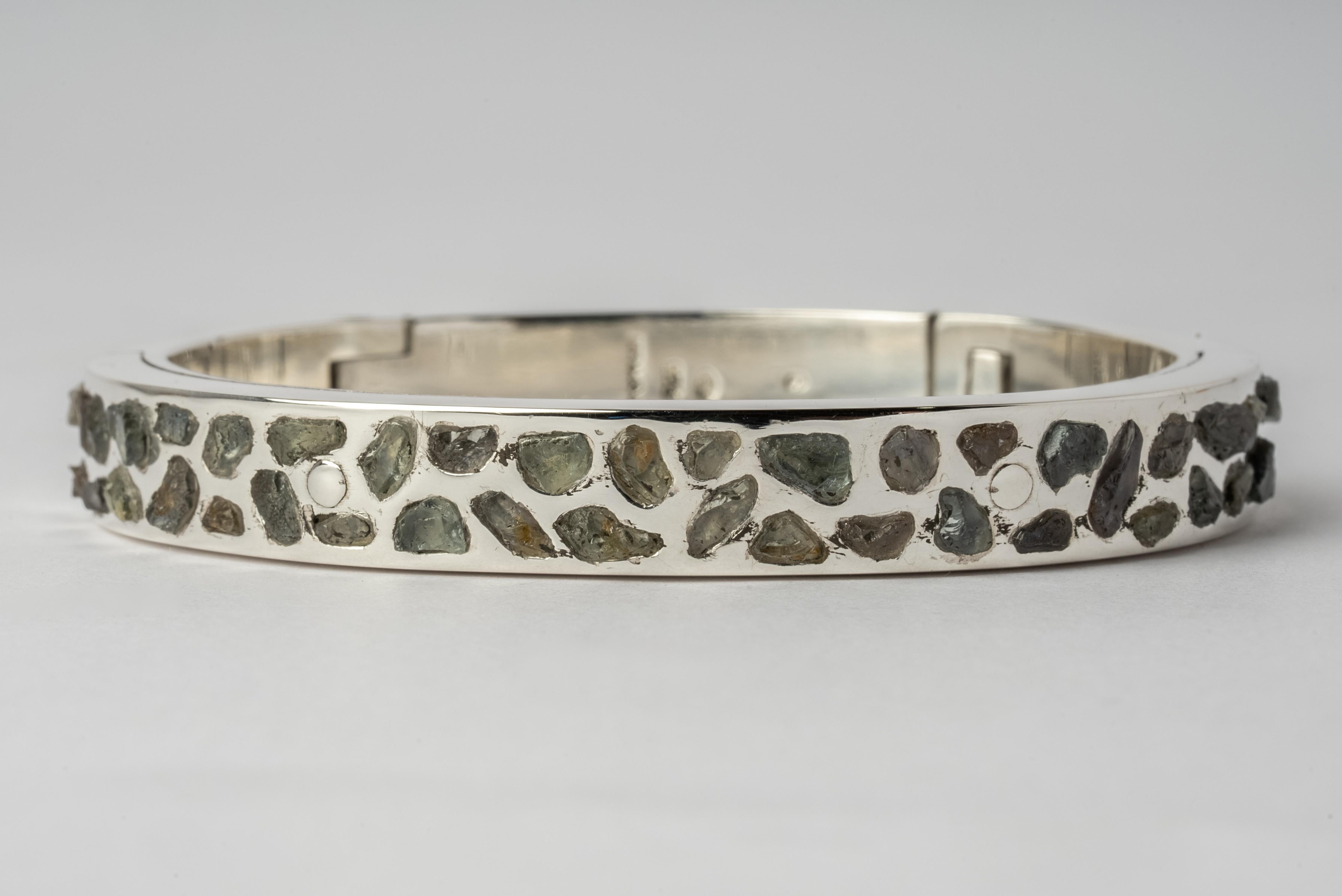 Sistema bracelet in sterling silver and slabs of rough sapphire. The 