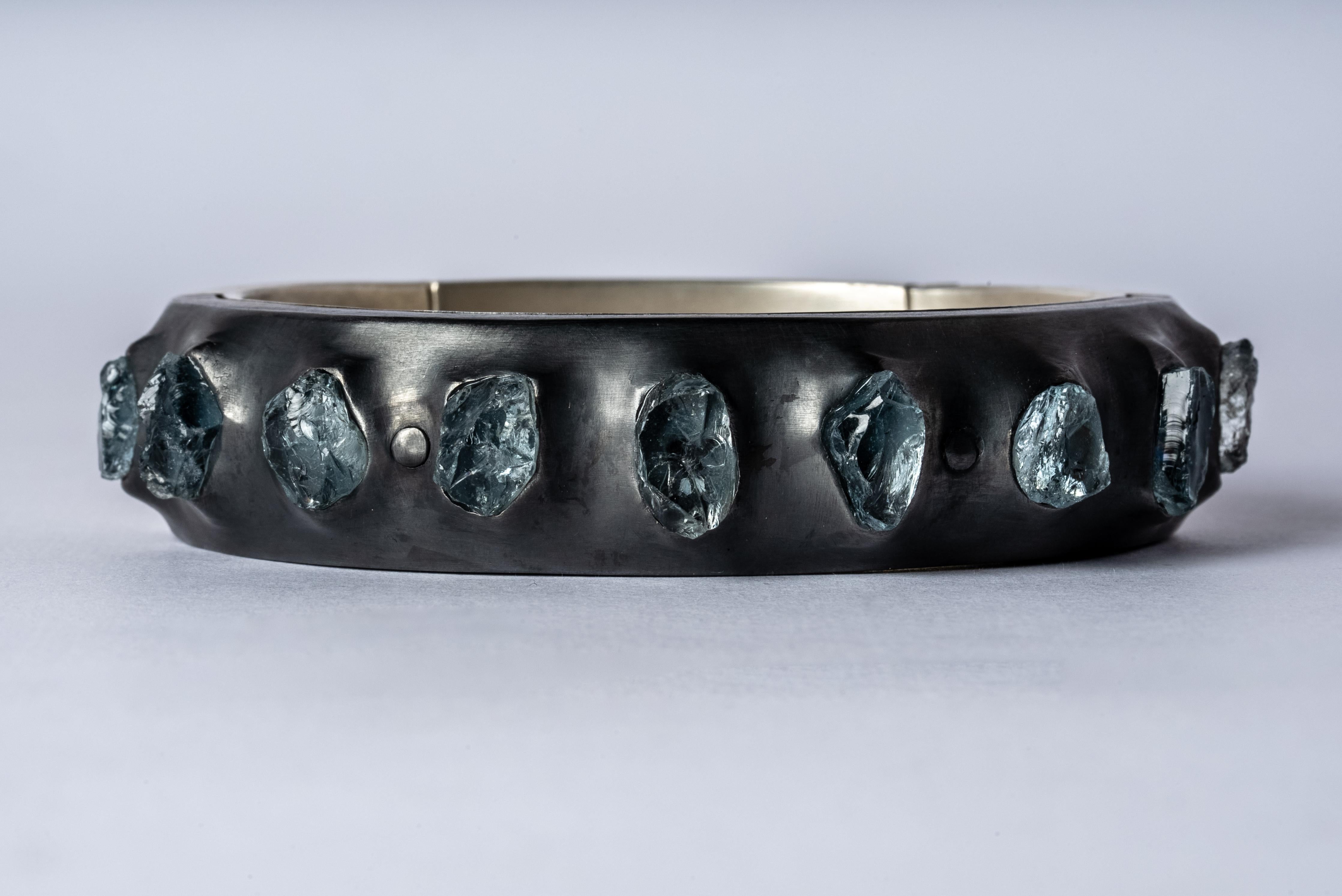 Sistema bracelet in sterling silver and slabs of rough aquamarine. The 