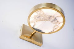 Sistema Solare Applique. Marmo Calacatta oro. Silvio Piattelli design