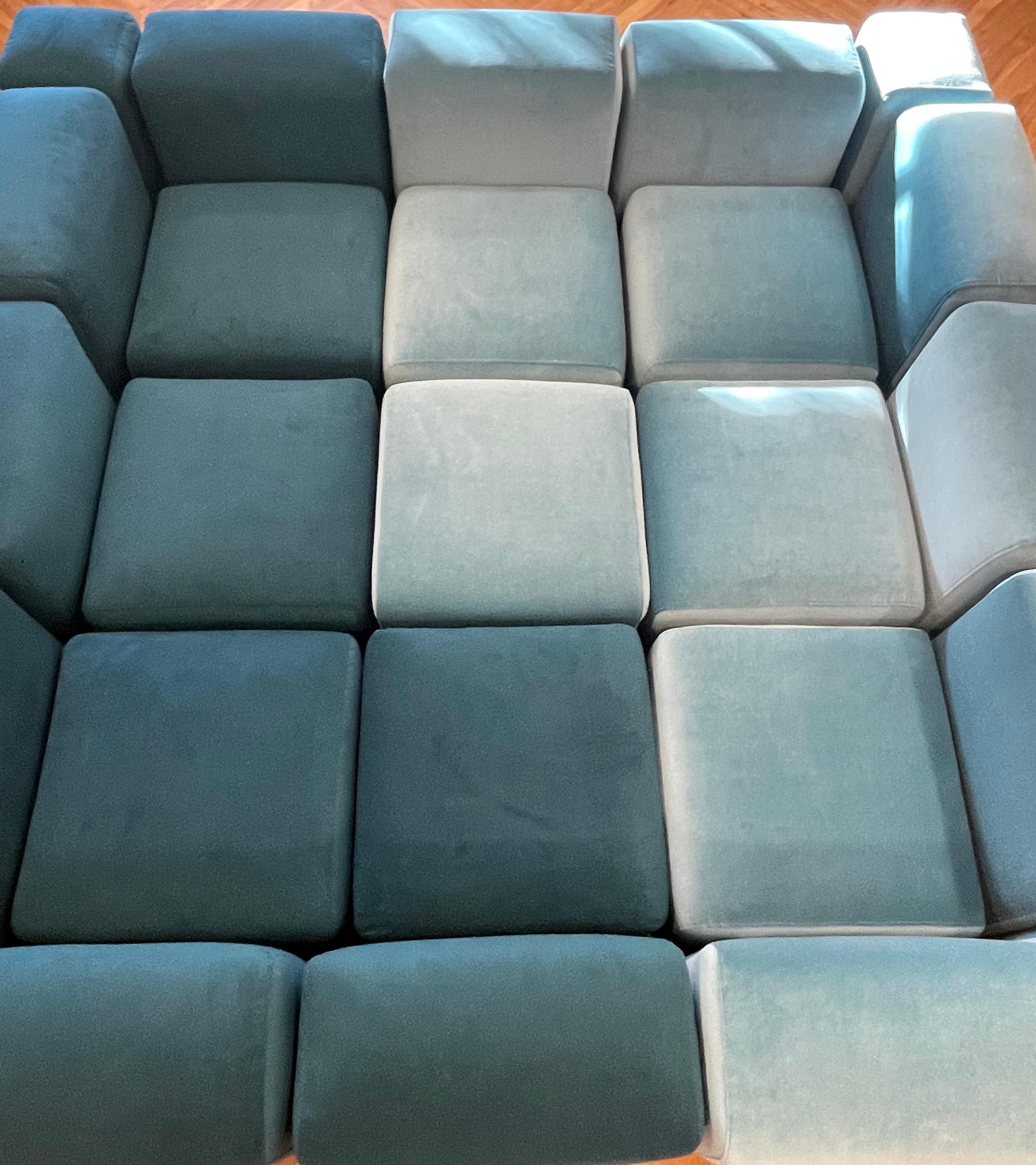 Rare massive 26 piece set. 13 backrests, 9 seats, and 4 corner pieces all with new foam reupholstered in 2 shades of blue mohair. 

Can be connected in any direction or formation using a series of chrome U-hooks (included) which hook into molds in