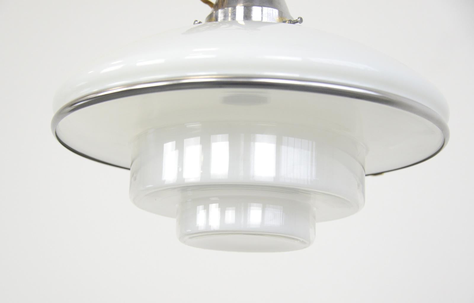 Sistra pendant light by Otto Muller, 1930s

- Original nickel coated brass gallery
- Opaline glass top with stepped glass base
- Takes E27 fitting bulbs
- Designed by Otto Muller for Sistra
- German, 1931
- Measures: 40 cm wide x 30 cm