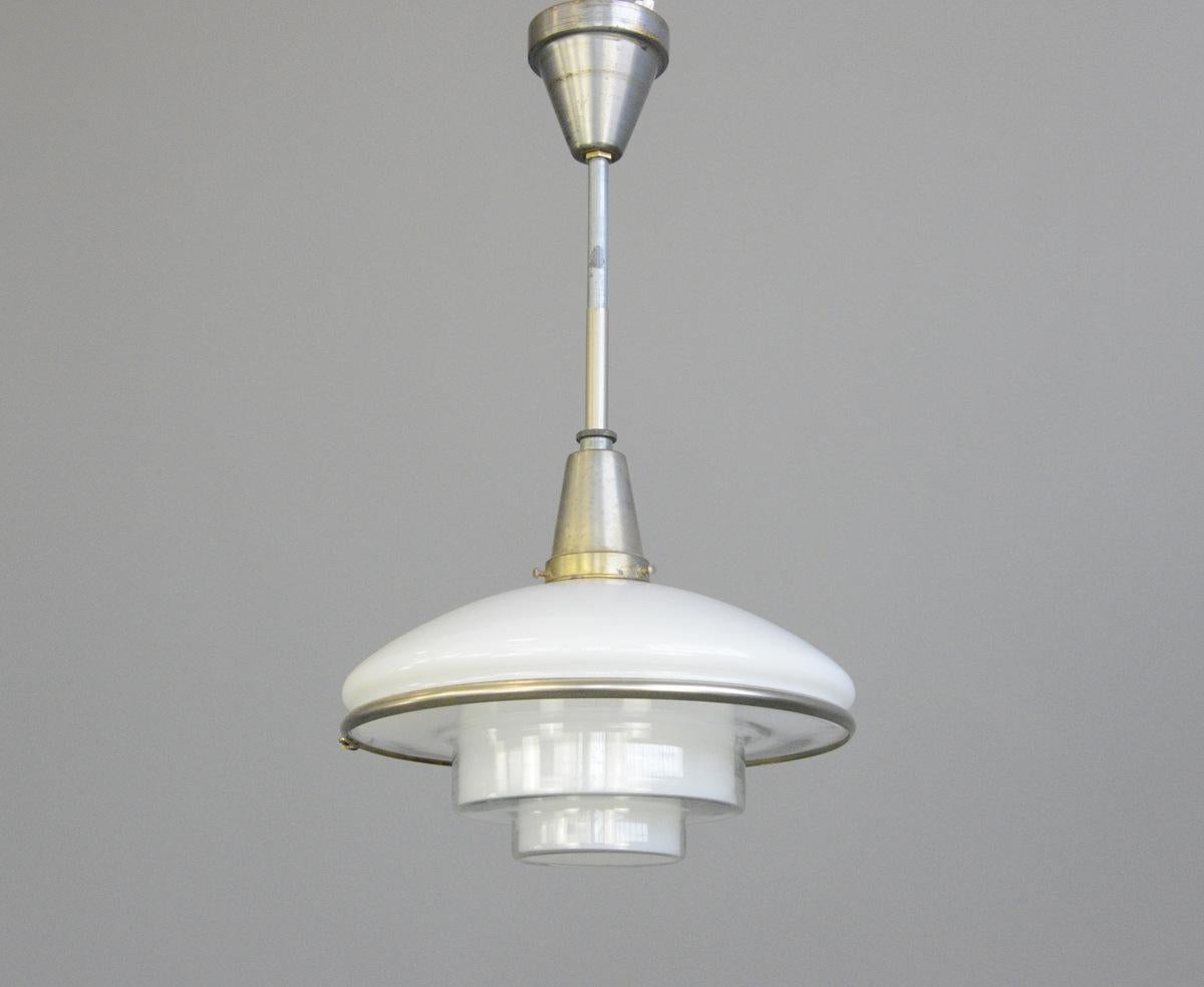 Sistrah pendant light by Otto Muller, 1930s

- Original nickel coated brass gallery and stem
- Opaline glass top with stepped glass base
- Takes E27 fitting bulbs
- Designed by Otto Muller for Sistra
- German, 1931
- Measures: 30cm wide x