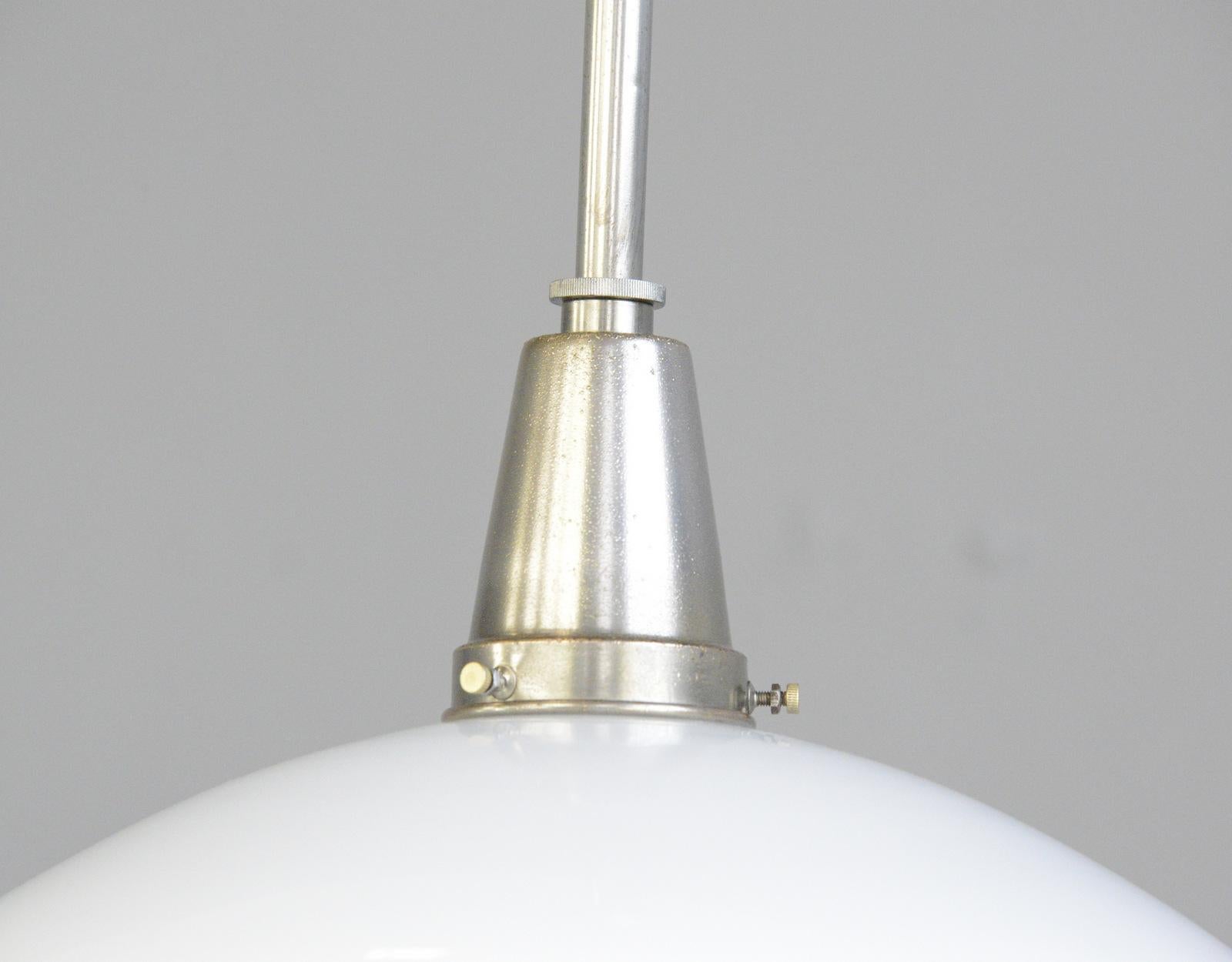 Sistrah pendant light by Otto Muller, circa 1930s

- Original nickel coated brass gallery and stem
- Opaline glass top with stepped glass base
- Takes E27 fitting bulbs
- Designed by Otto Muller for Sistrah
- German, 1930s
- Measures: 32cm