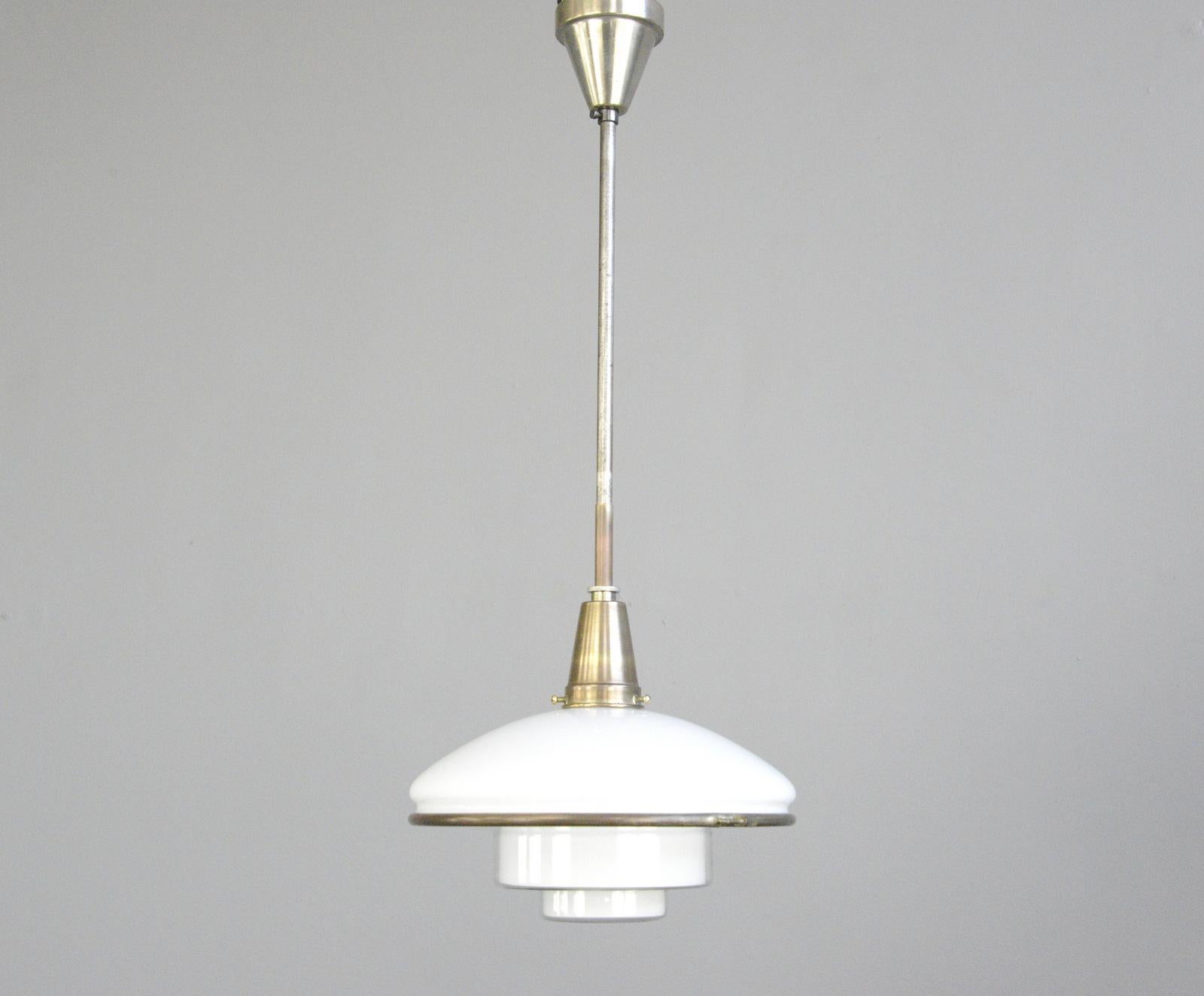 Sistrah pendant light by Otto Muller, circa 1930s

- Original nickel coated brass gallery and stem
- Opaline glass top with stepped glass base
- Takes E27 fitting bulbs
- Designed by Otto Muller for Sistrah
- German, 1930s
- Measures: 32cm