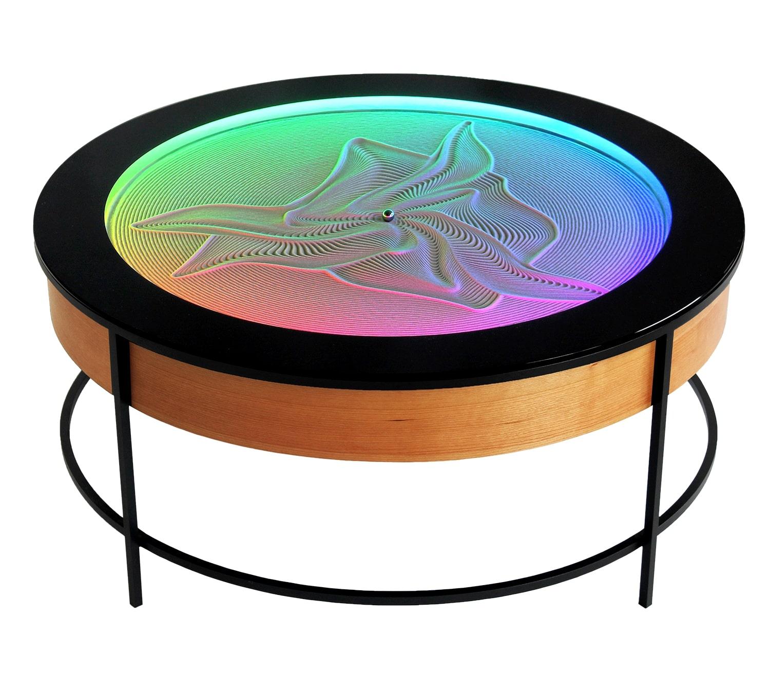 Erleben Sie die Schönheit der kinetischen Kunst mit dem Sisyphus Metall Couchtisch. Mit einem Durchmesser von 3′ ist dieser Tisch ein echter Hingucker - sei es, um Kunden und Kollegen im Büro zu beeindrucken, oder um Ruhe und Komfort in Ihr