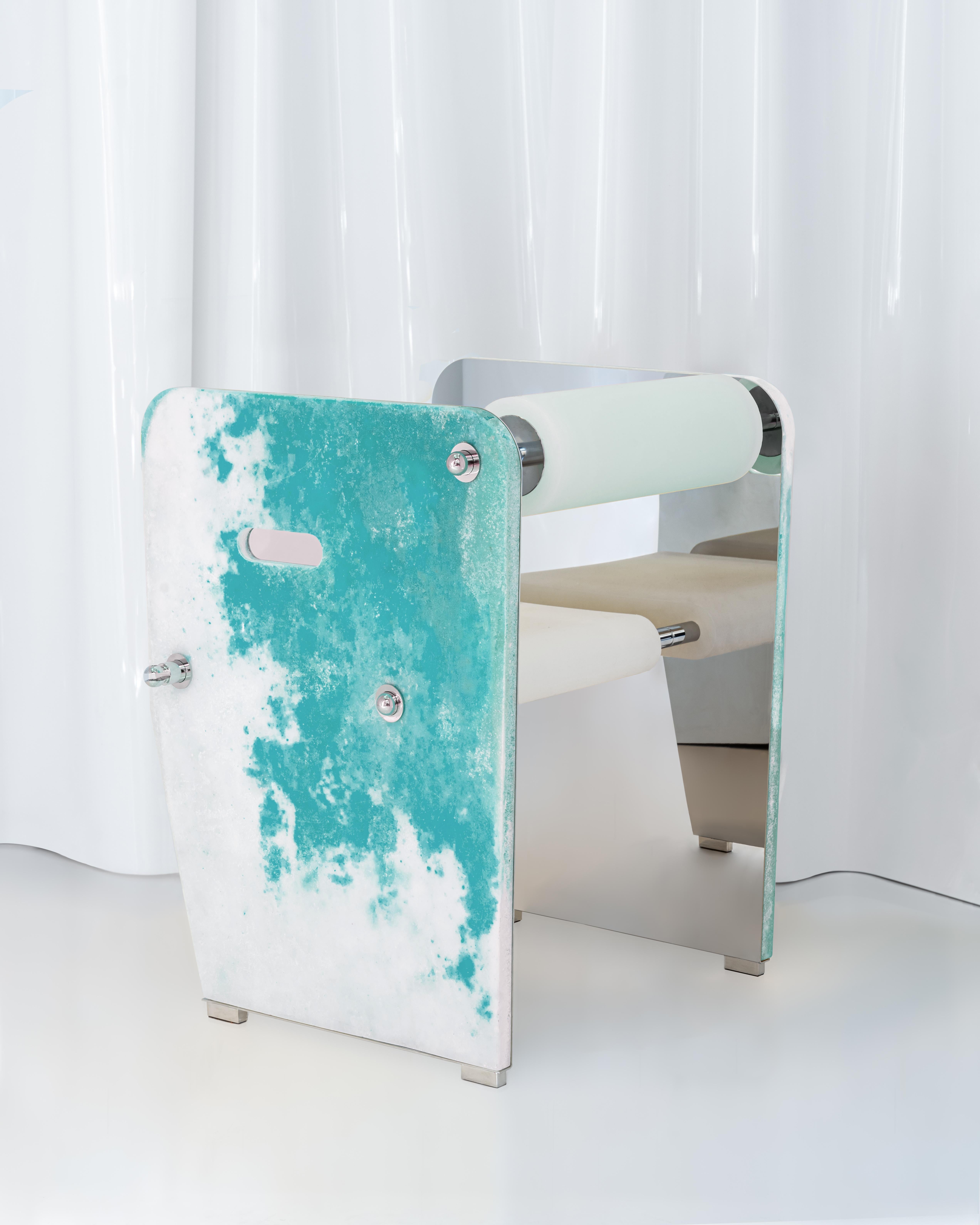 SIT/LIT consists of two stainless steel shoulders, with a chrome finish, horizontally connected to each other by tubular bars also made of steel. The seat and back are made of rubber, a translucent cast material whose consistency was chosen to