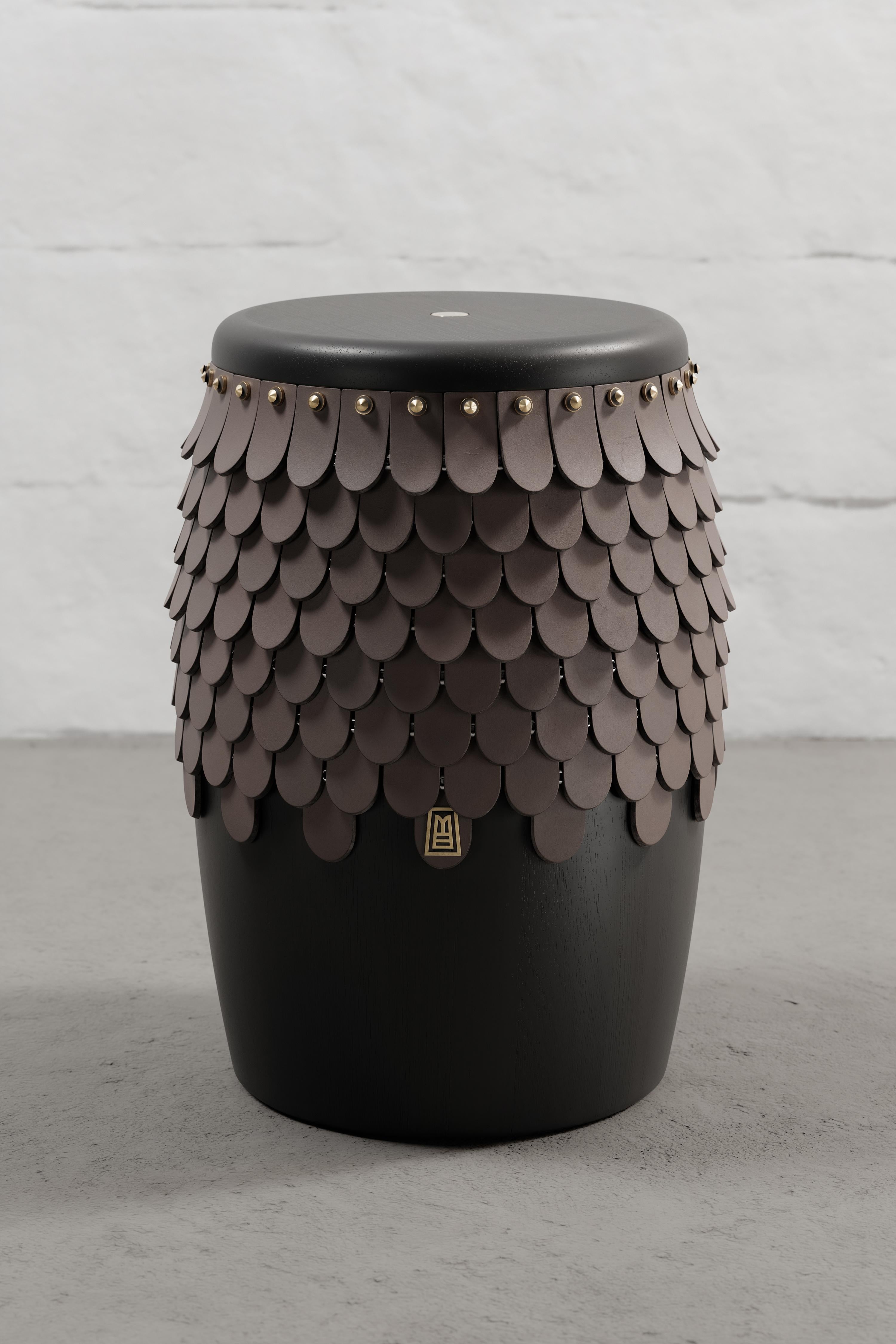 Stool crafted from solid Seike wood with Ébano finish, featuring thick leather accents, and aged bronze or stainless steel CNC-lathed hardware.

Our SITIERA_01 stool and side table embodies our commitment to conscious design, reflected not only in