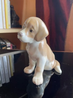 Sitting porcelain dog puppy, Royal Copenhagen. Denmark 1920s.