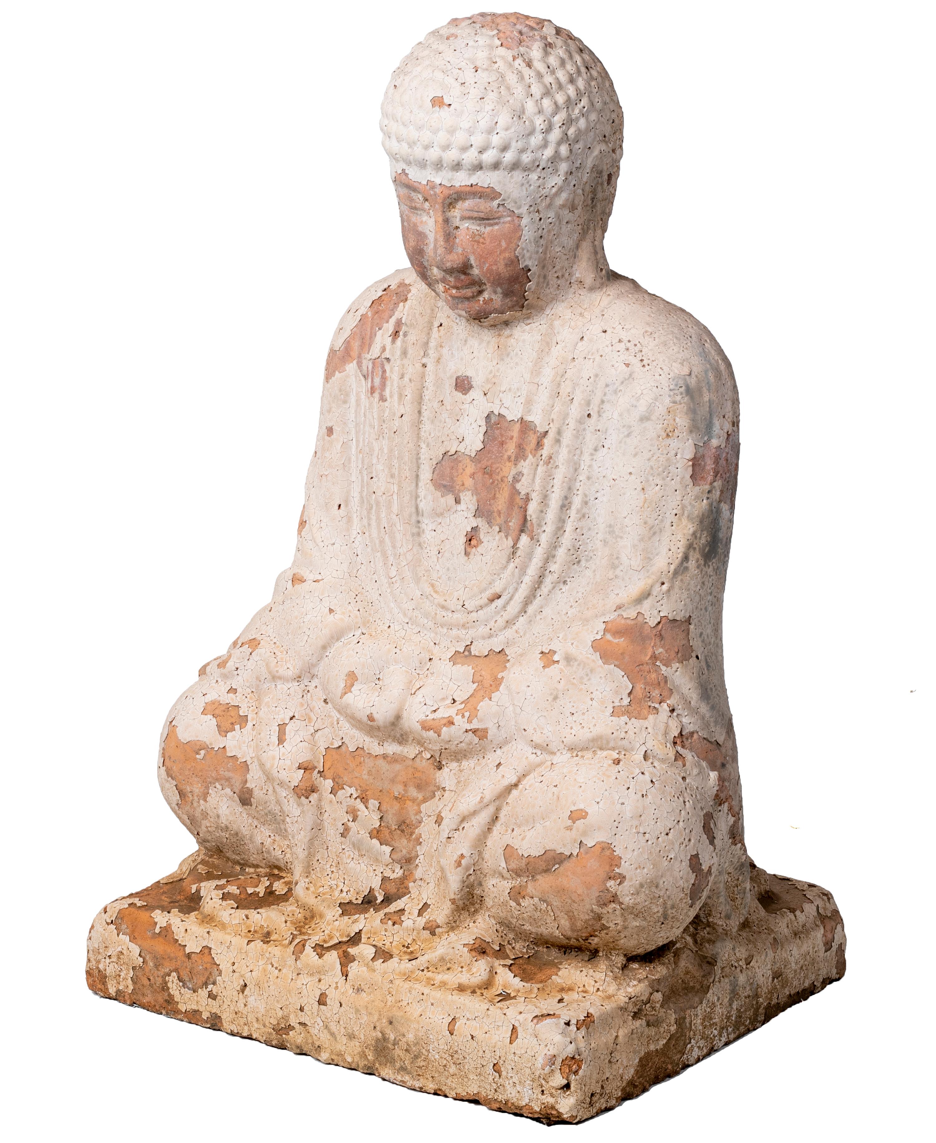 Sitting terracotta Buddha sculpture with white antique finish.