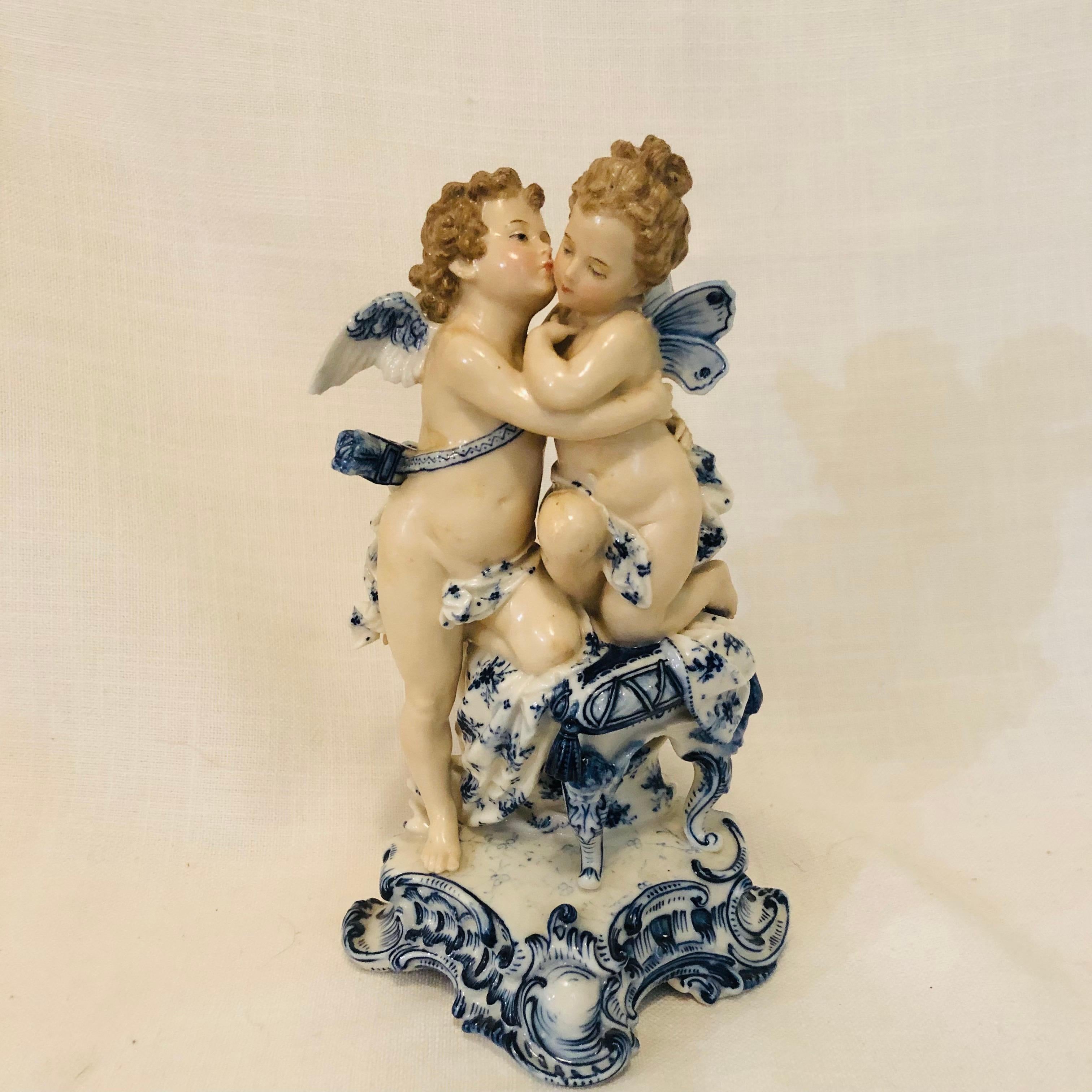 German Sitzendorf Dresden Figurine with Kissing Angels with Blue and White Decoration