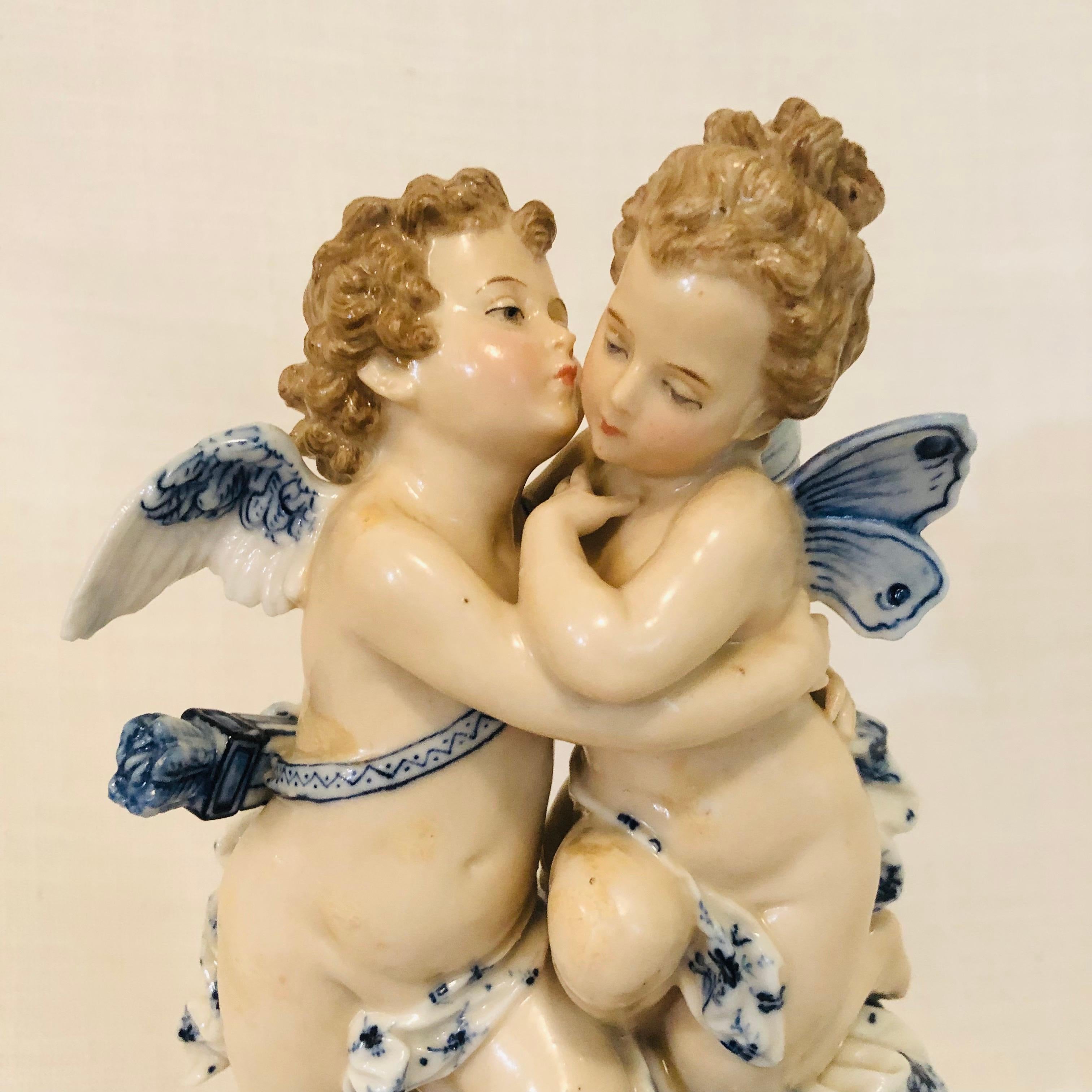 Hand-Painted Sitzendorf Dresden Figurine with Kissing Angels with Blue and White Decoration