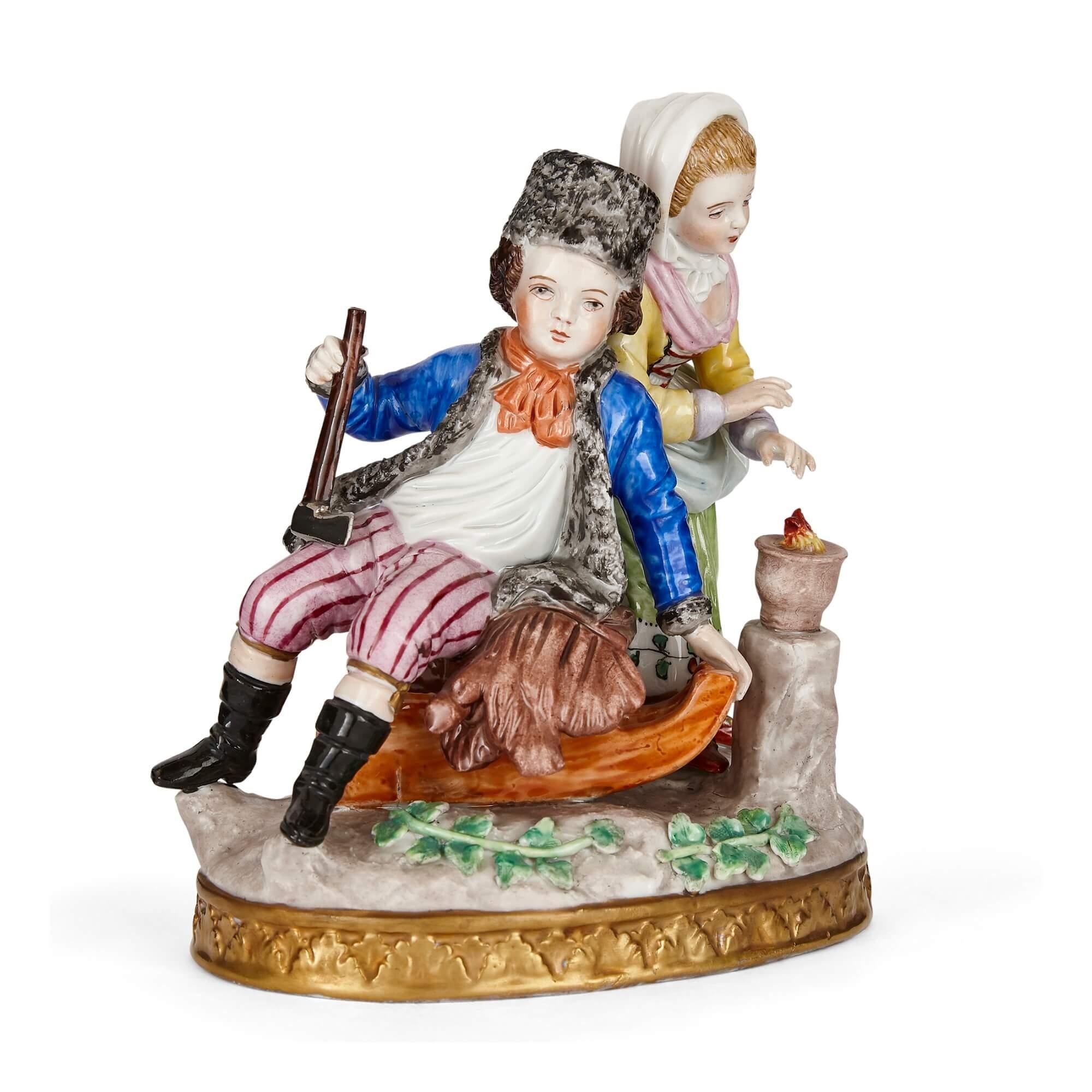 Sitzendorf porcelain group of a young couple
German, c. 1900
Measures: Height 16cm, width 14cm, depth 9cm

This charming and vibrantly coloured porcelain group depicts two figures—one a young boy, the other a young girl—in warm winter dress. The