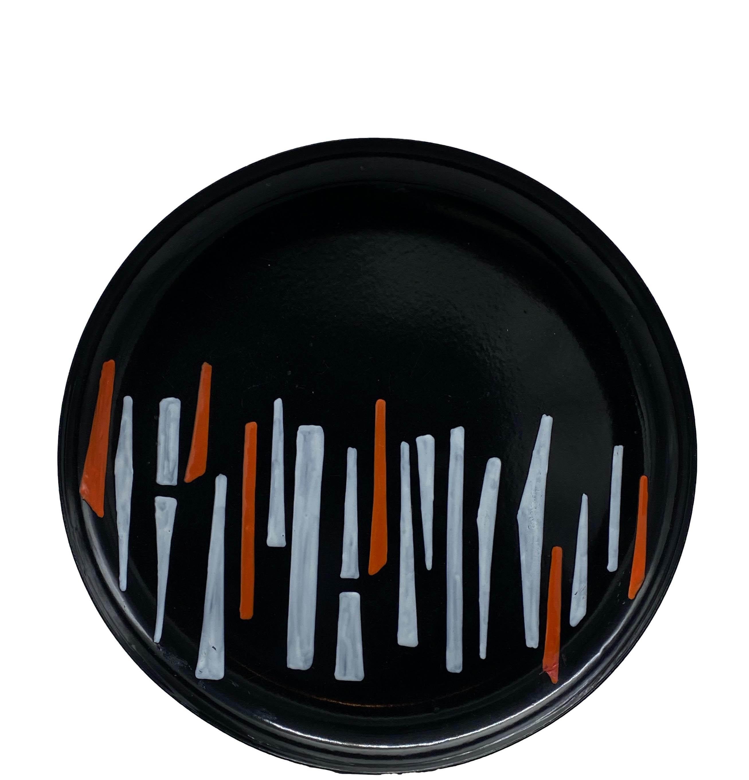 A large and beautiful 1950s circular art plate of Italian design by Silvia Poggi Bonzi. Abstract enamel decoration on black, orange and white metal. Curved edge. This bowl can be used as a tidy tray or centrepiece.