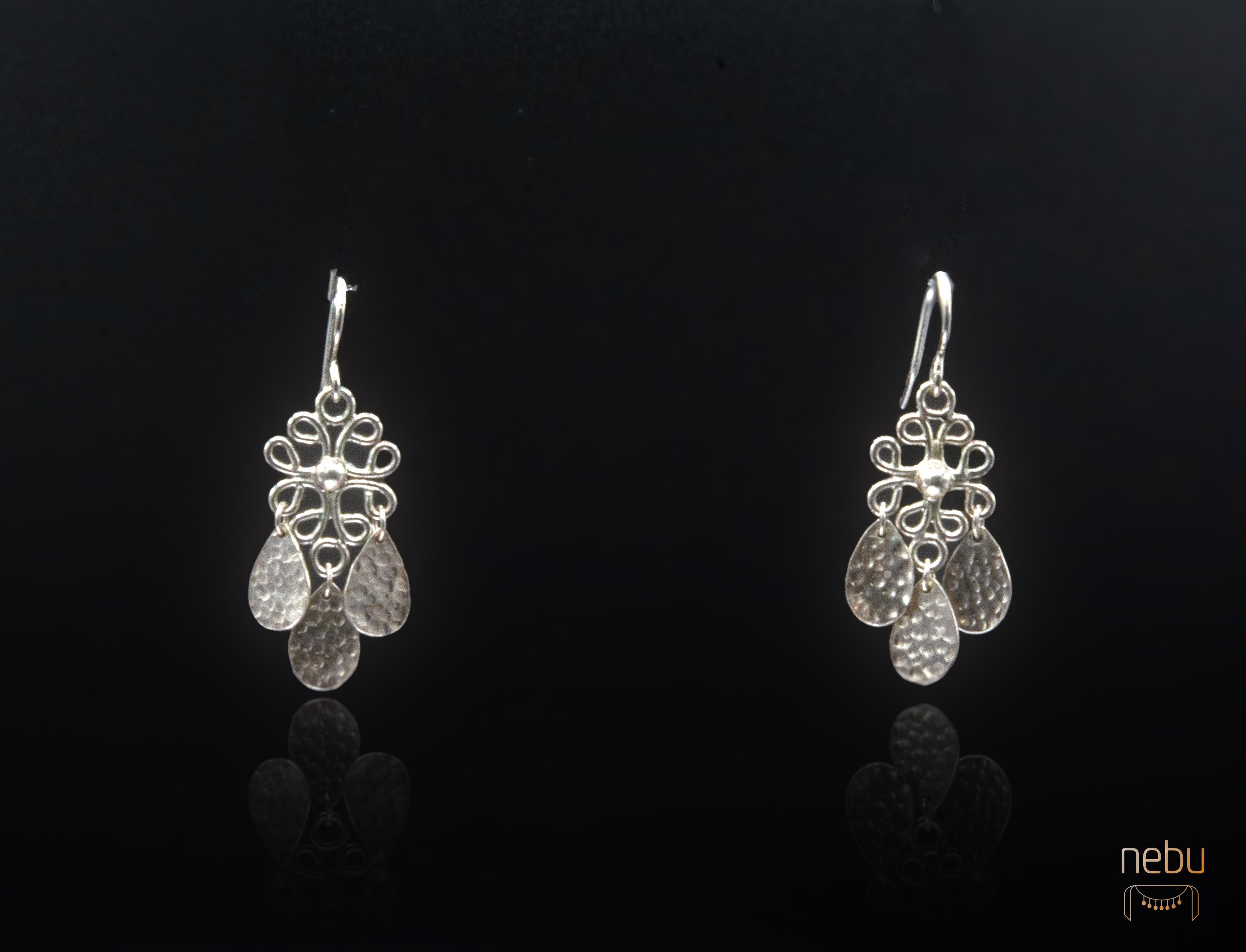 - Available 
- Handmade
-Sterling silver
- 4cm long
-Stamped with the Nebu logo 
-Also available in 18K gold

Inspired by the intricate motifs found in traditional Indonesian jewelry, these earrings boast delicate open filigree work that exudes