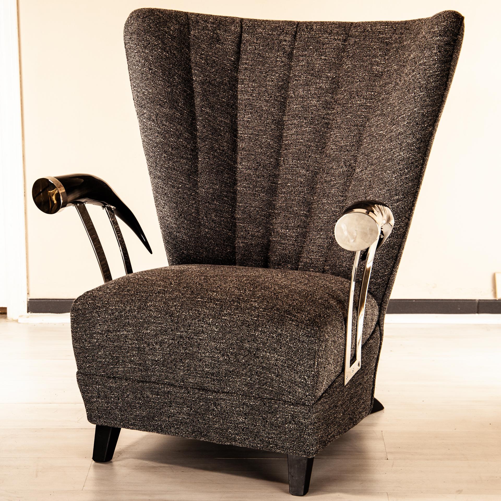 Imposing lounge armchairwith American natural Horn arm-rest. Horns are capped with brass that is made to fit and armrest holder gives a stilish modern design touch.

Upholstered and manufactured in Florence, Tuscany by Selezioni Domus.

Shown in