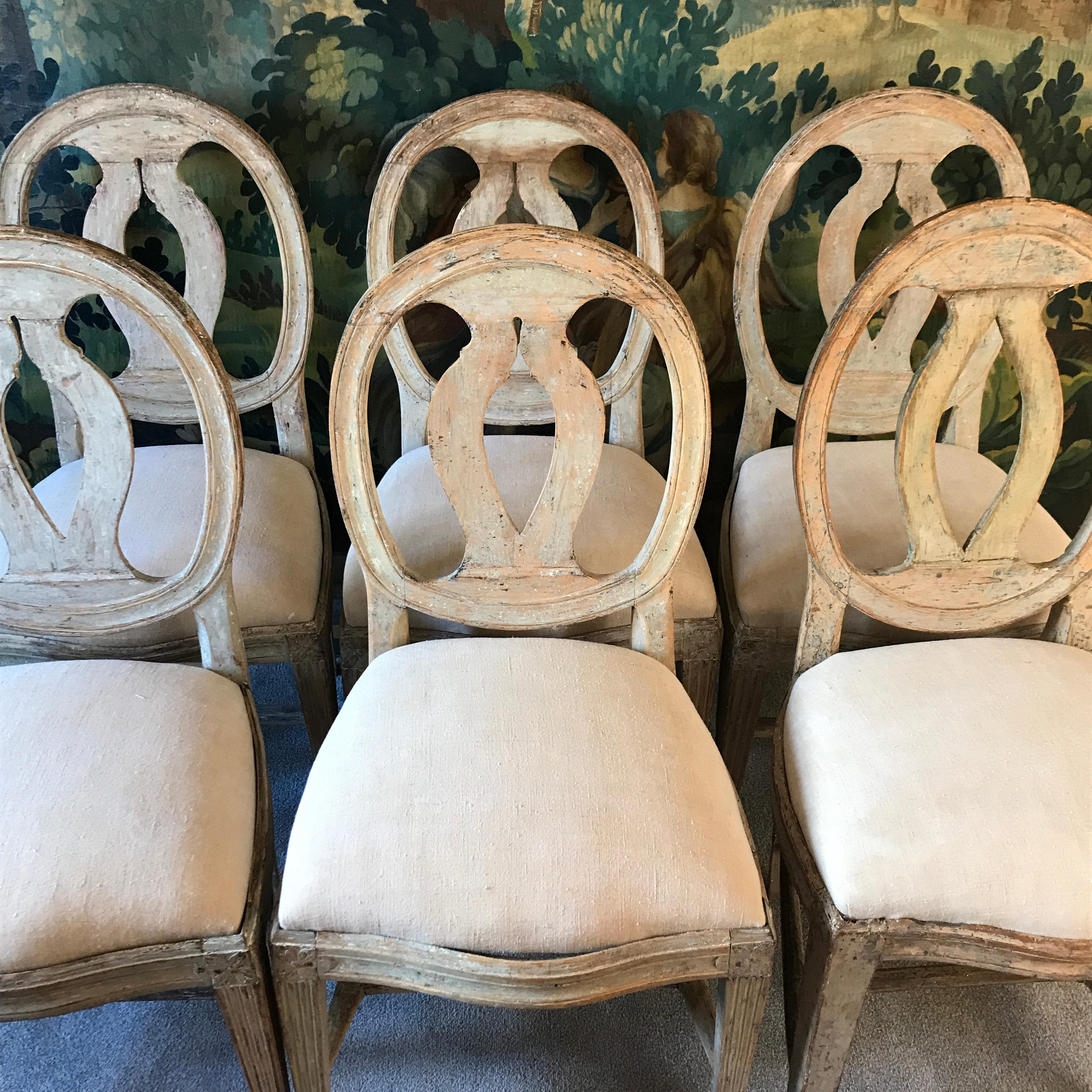 A harlequin (matched) set of six late 18th century Swedish period rococo side or dining chairs in original paint - ( a soft pale grey to green colour) 
Strong and stable for use with drop in seats recovered in a pale sand antique linen ( not as