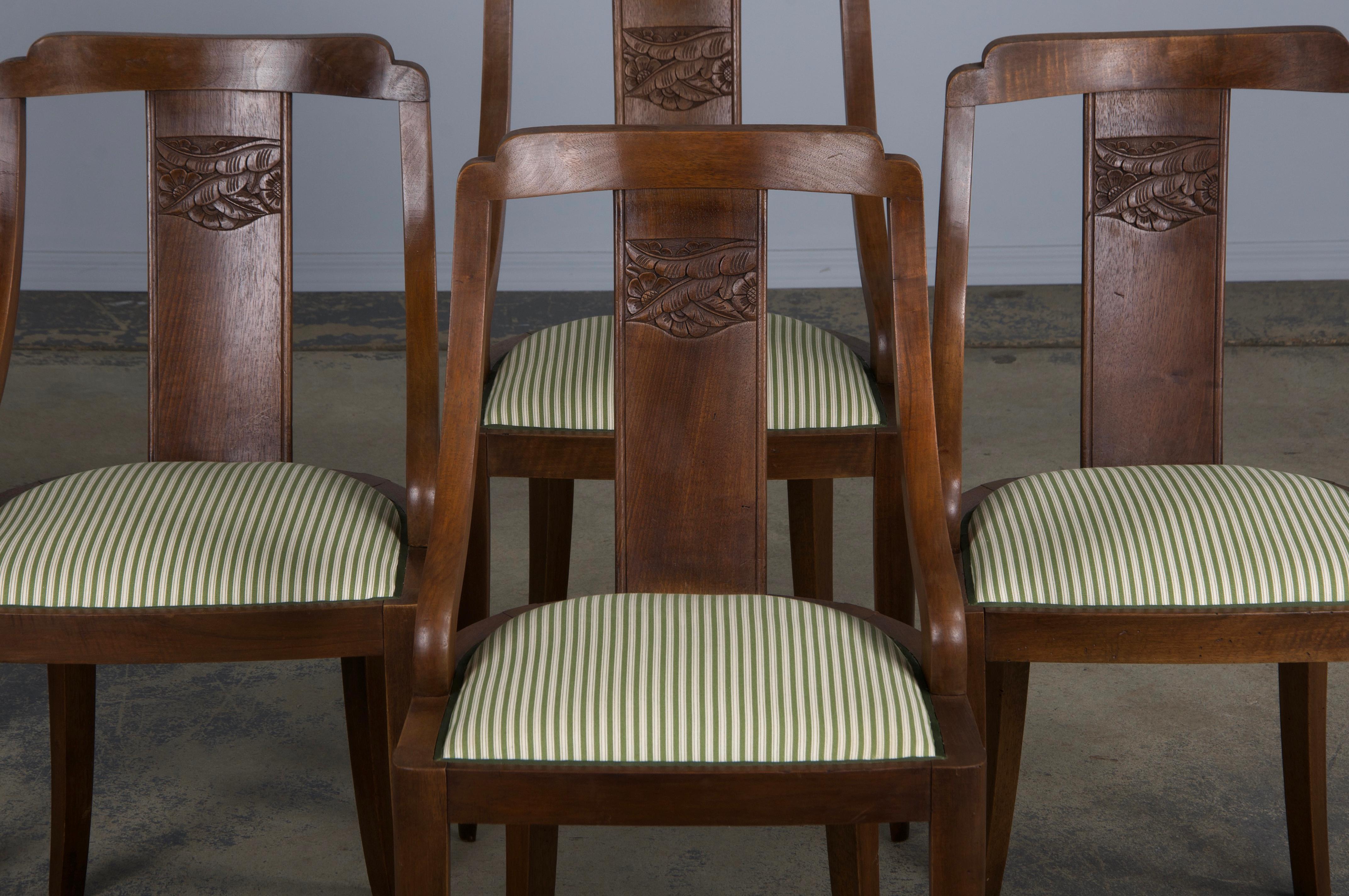 An elegant set of six 1930s French Art Deco gondola dining chairs, sourced from Provence, France. Expertly handcrafted from solid walnut, the chairs feature a rich, naturally aged brown patina that enhances their character. The frames are adorned