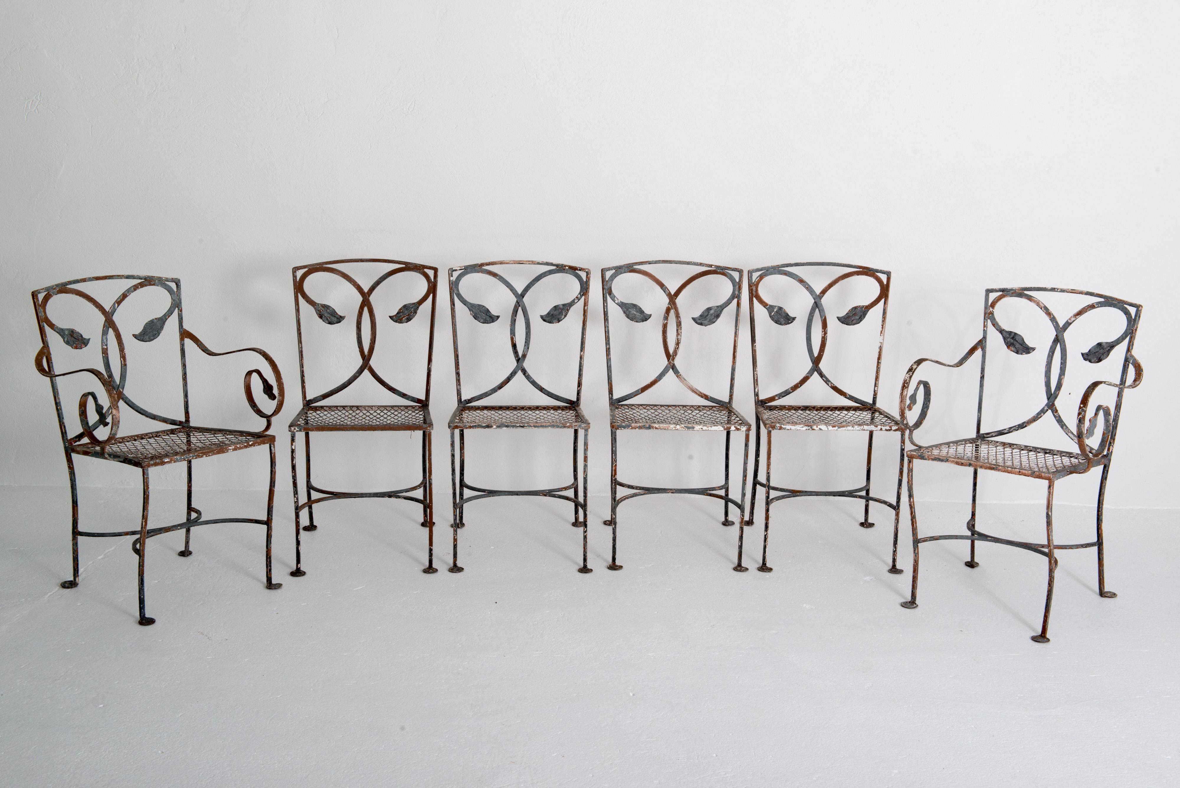 Six 1930s hand wrought iron Salterini dining chairs. Two arm chairs & four side chairs. Side Chair: 16.75