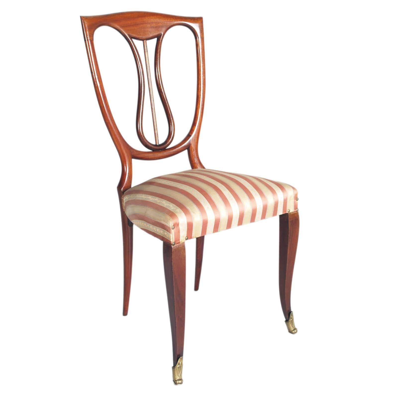 Elegant  1940s  six chairs in mahogany laquered, Melchiorre Bega attributed; neoclassical stylized LIRA backrest. Feet in embossed gilded brass. 
Chairs to be reupholstered with fabric in shades on request, included in the price
Chairs of great