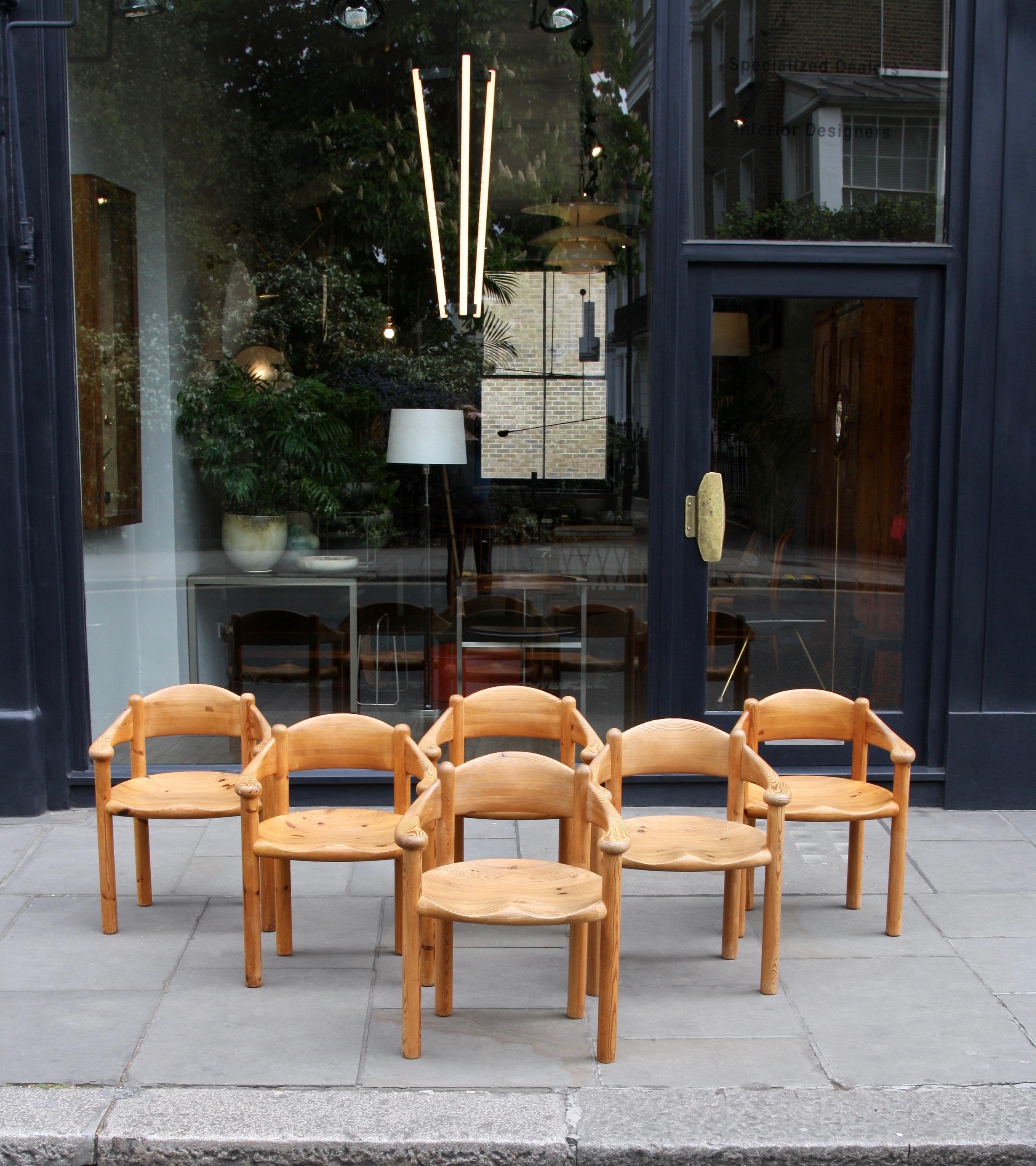 A set of six solid pine 'carver' chairs designed by architect Rainer Daumiller in 1977 and made by Hirtshals Savværk around the same date.
Although made of solid wood and being impressive in size and proportions the chairs' have a visual lightness