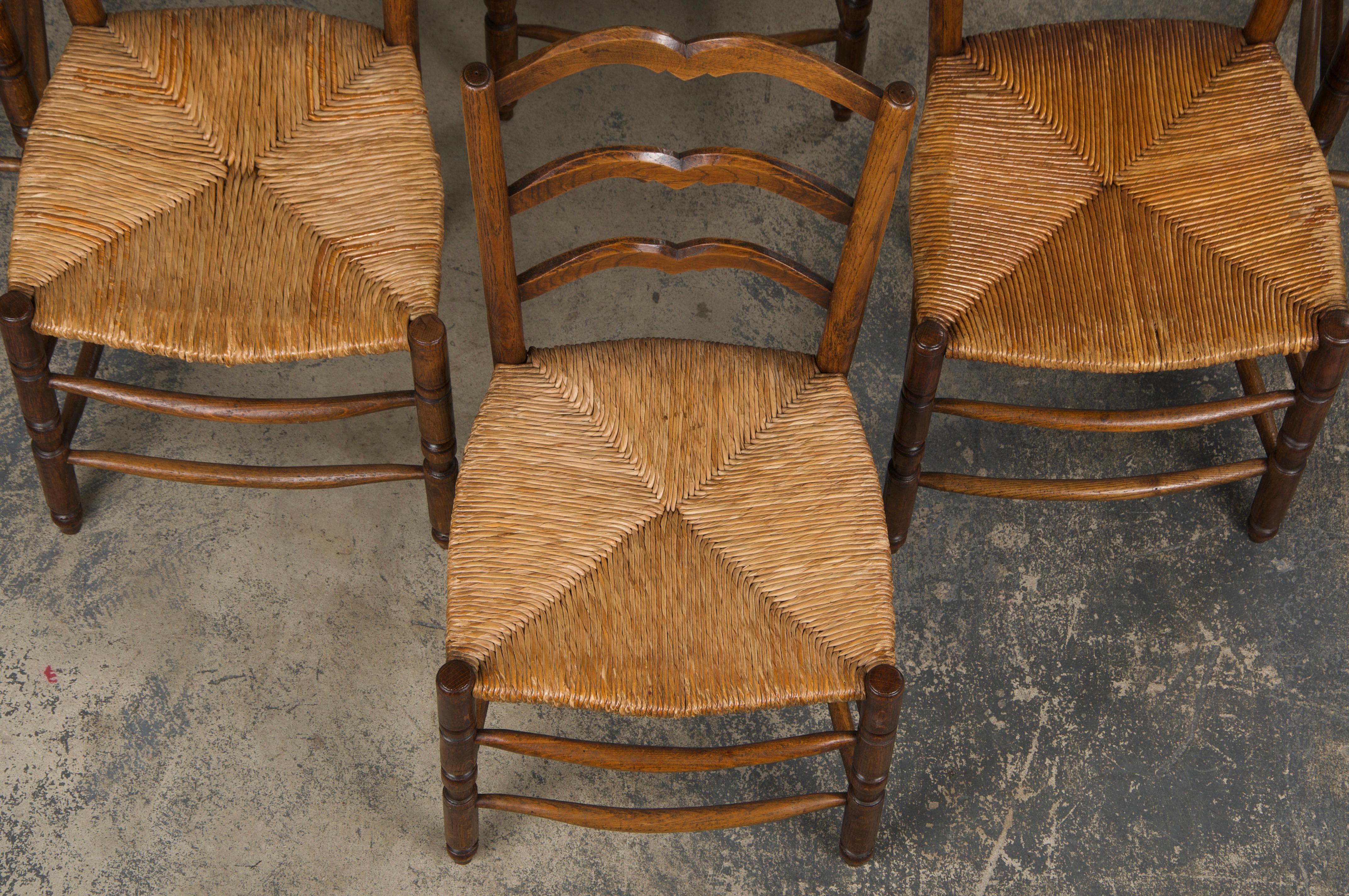 Six 19th Century French Provincial Ladder Back Oak Dining Chairs W/ Rush Seats In Good Condition For Sale In Astoria, NY