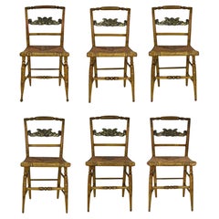 Six 19th century  handpainted Sheraton dining chairs with rush seats