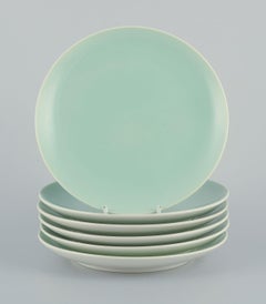 Six Aluminia "Confetti" plates in mint green glazed earthenware. Mid-20th C