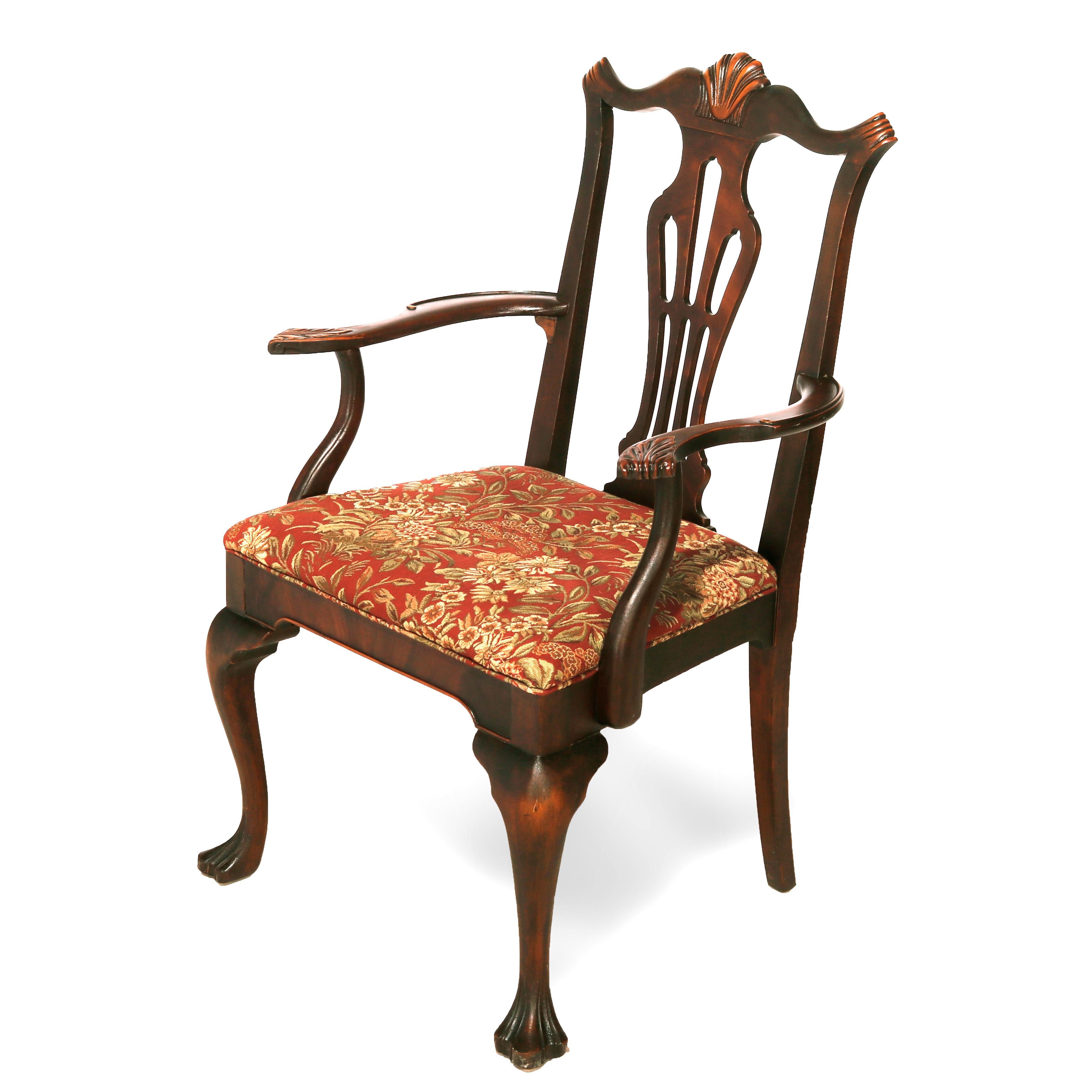 A set of six Chippendale style dining chairs offer mahogany construction with crest having stylize shell over pierced slat backs, raised on cabriole legs with carved stylized paw feet, c1940

Measures - 40
