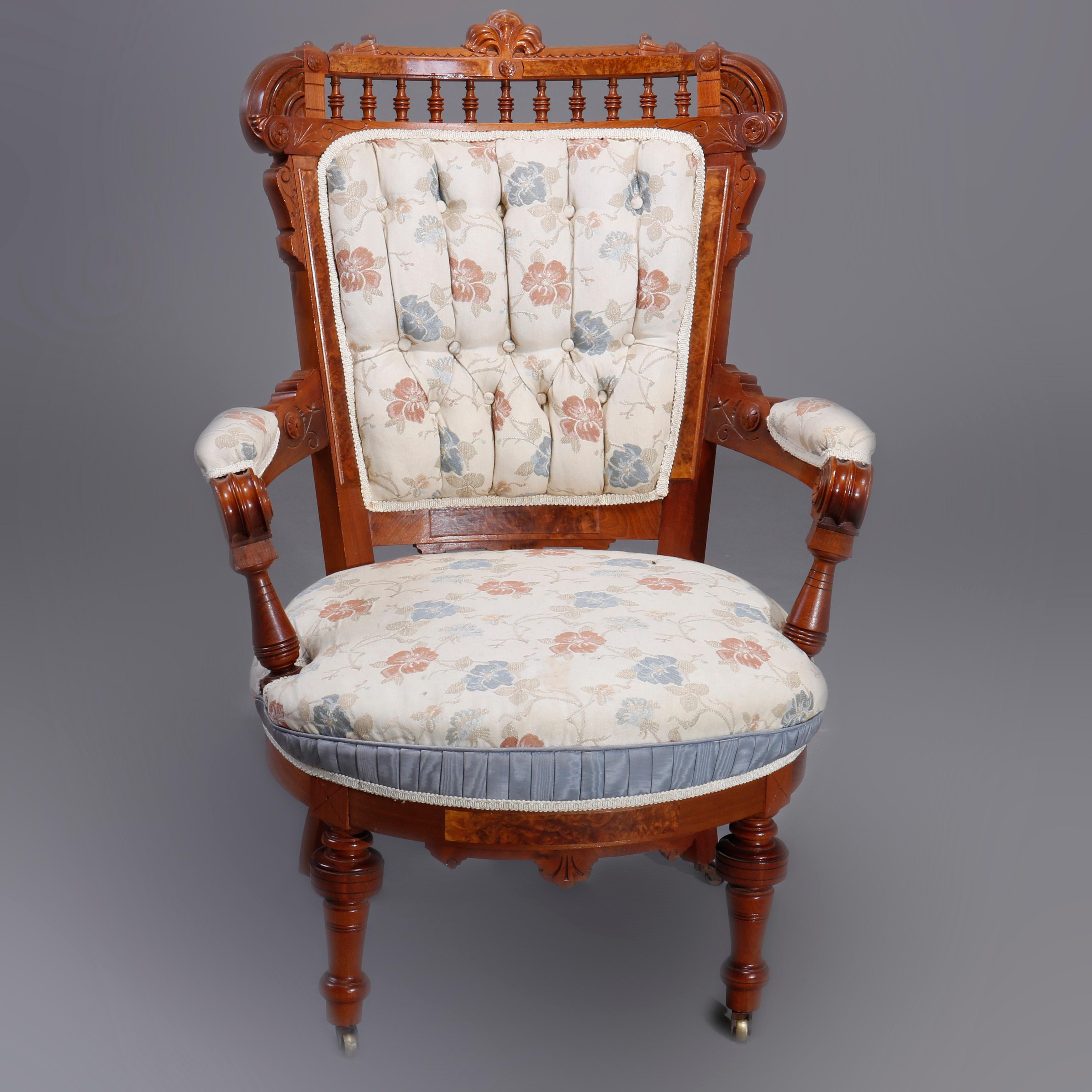 A set of six antique Eastlake parlor chairs offer walnut construction with burl insets and having spindle crest with carved and incised foliate decoration over button backs and raised on turned legs, set includes one gentleman's chair, one ladies