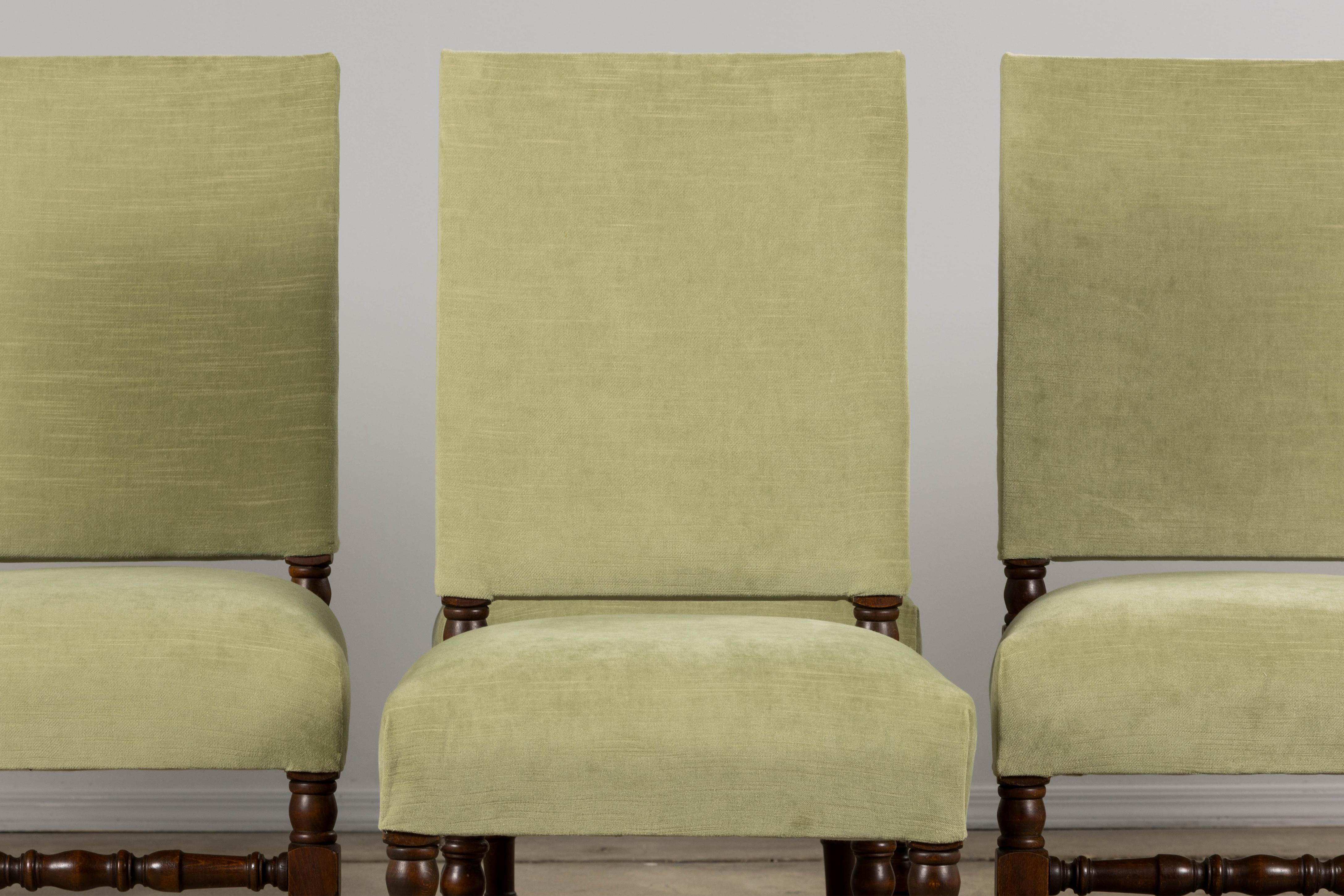 A handsome set of six late 19th-century French dining chairs in the Louis XIII style, sourced from Provence. Expertly handcrafted from solid oak, each chair features a distinctive square backrest and has been structurally restored for lasting