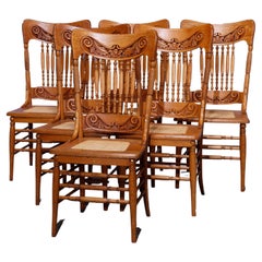 Six Used Oak Spindle & Pressed Back Cane Seat Dining Chairs, c1910