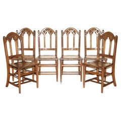 SIX ANTIQUE ORNATELY CARVED STEEPLE BACK WALNUT GOTHIC REVIVAL DiNING CHAIRS