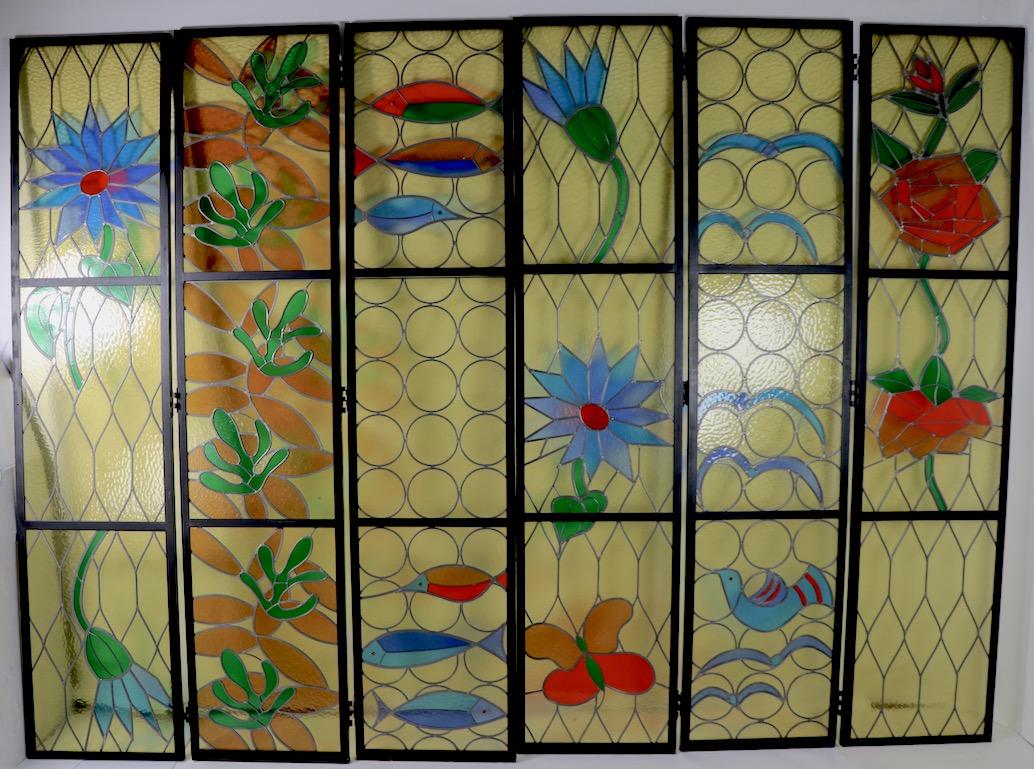 Wonderful set of six large leaded panels, comprised of two sets of three. Each set of three included two side panels and a middle panel, each panel 102.5 inches H x 23 W x 1.25 D. We have priced the panel individually, however we would love to see