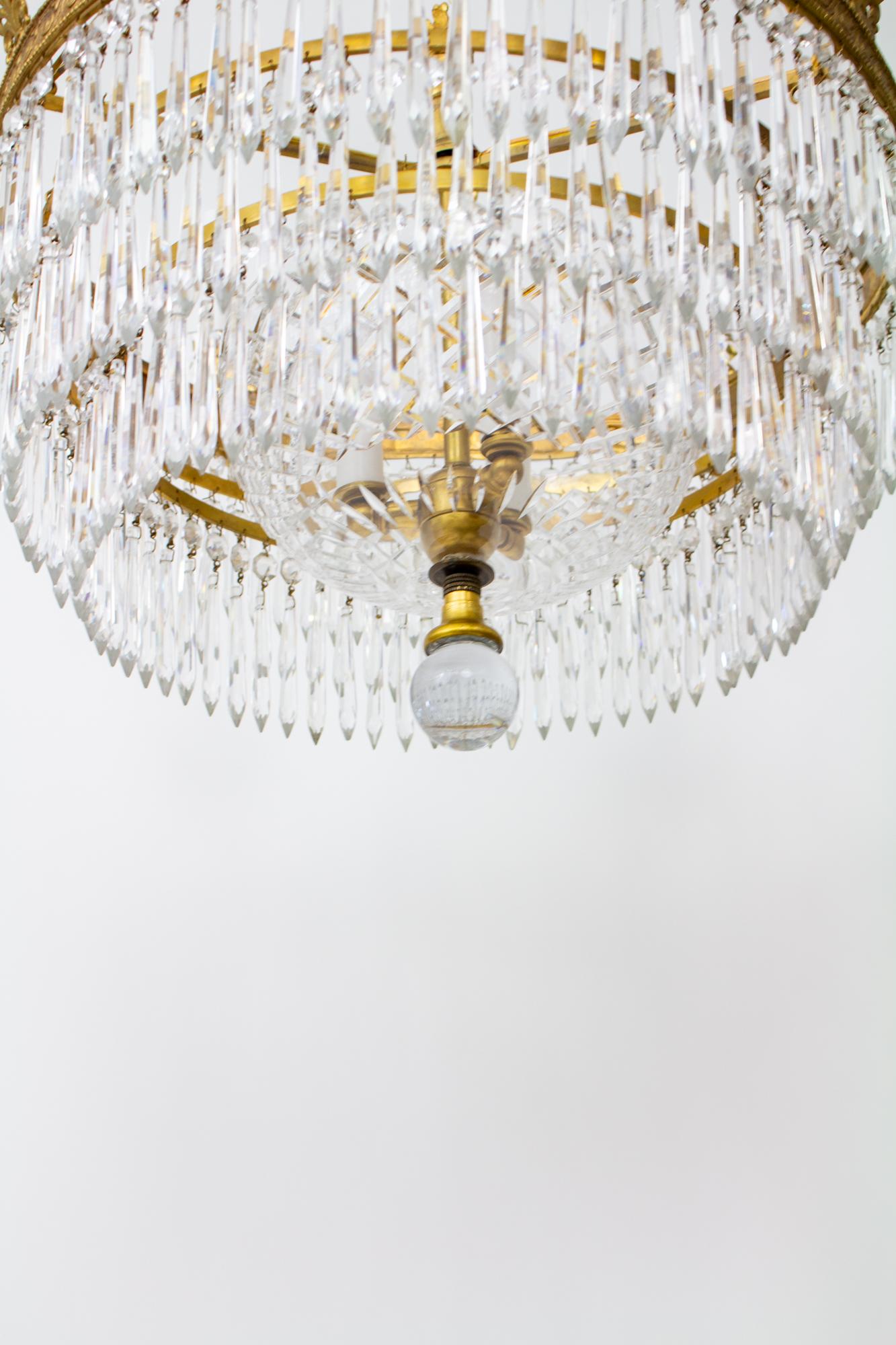 20th Century Six Arm Brass and Crystal Empire style Chandelier For Sale