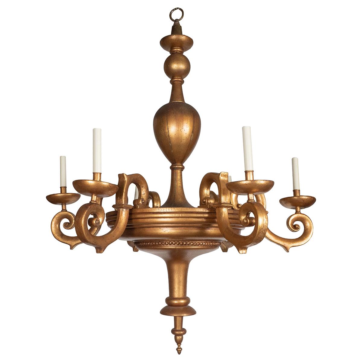 Six-arm gilt and turned wood chandelier with curvilinear tendril arms.