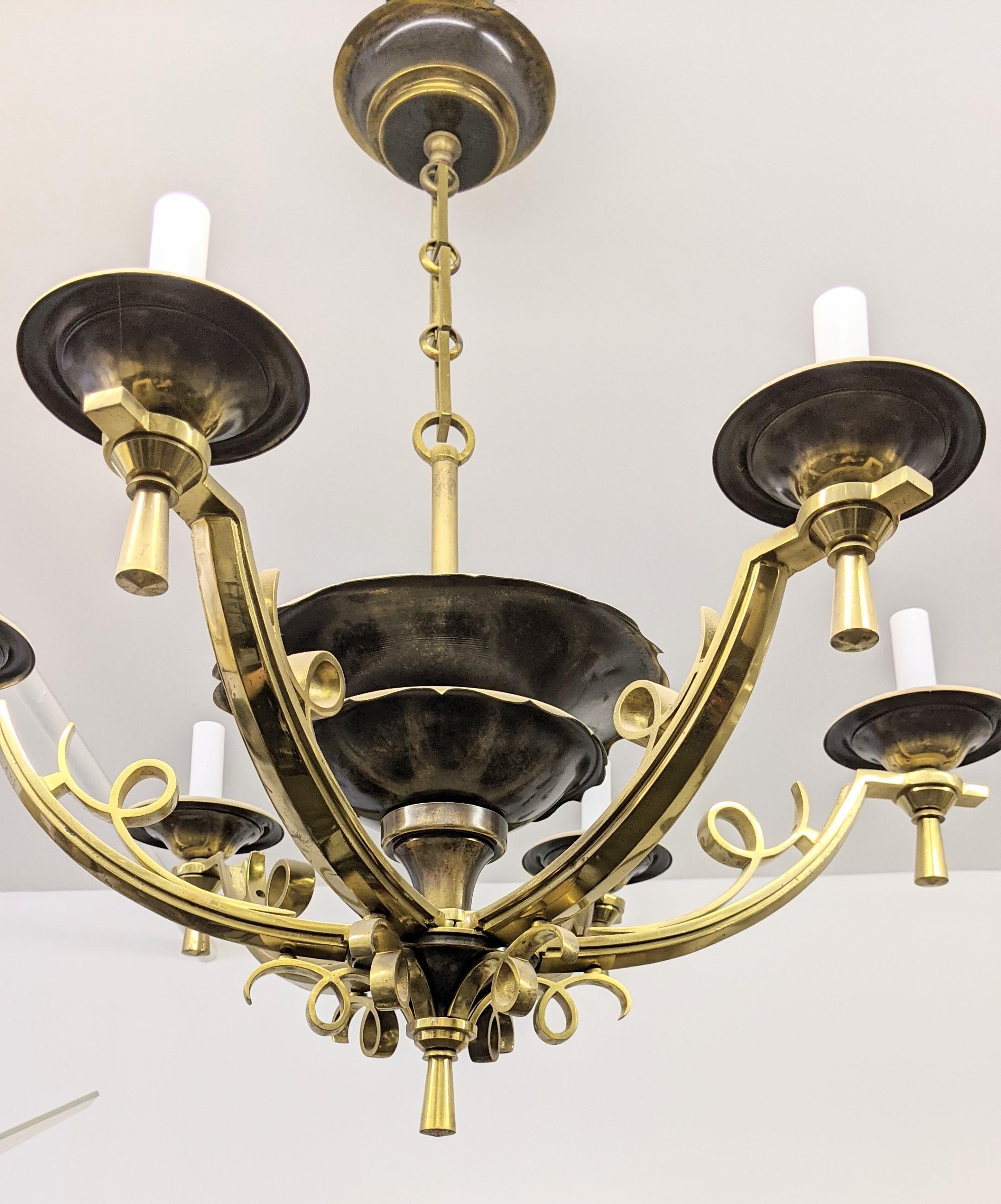 A gorgeous elegant 1940's French Art Deco polished bronze Six Arm Chandelier with black-brown patina in perfect condition, modest wear commensurate with age. Rewired to U.S. standards, accommodate candelabras bulbs, six on the arms with two
