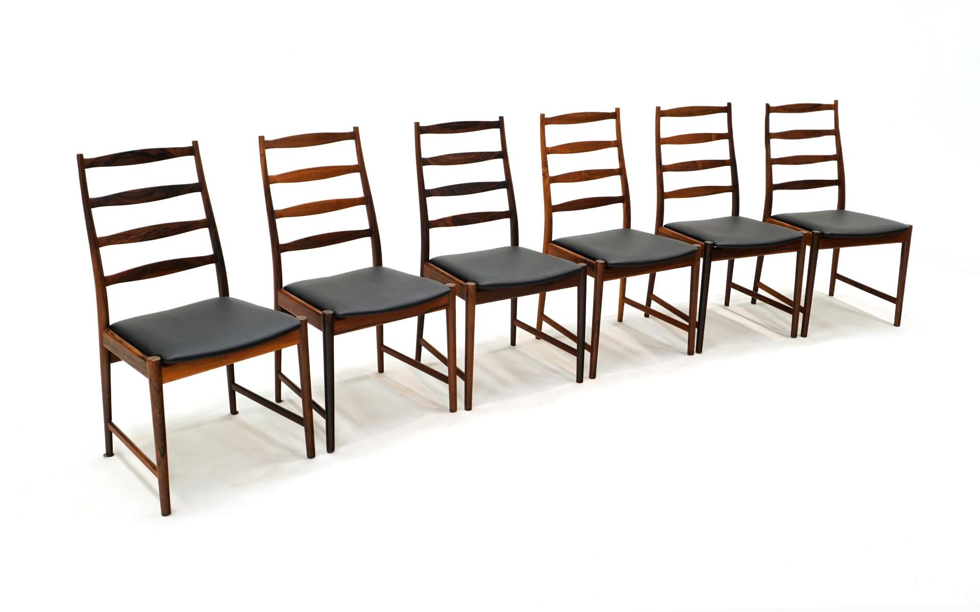 Set of 6 armless dining chairs designed by Arne Vodder and made by Vamo Sonderborg, Denmark, 1960s.  Brazilian rosewood frames and black leather seats.  Expertly refinished and reupholstered.  An excellent set of these important mid century modern