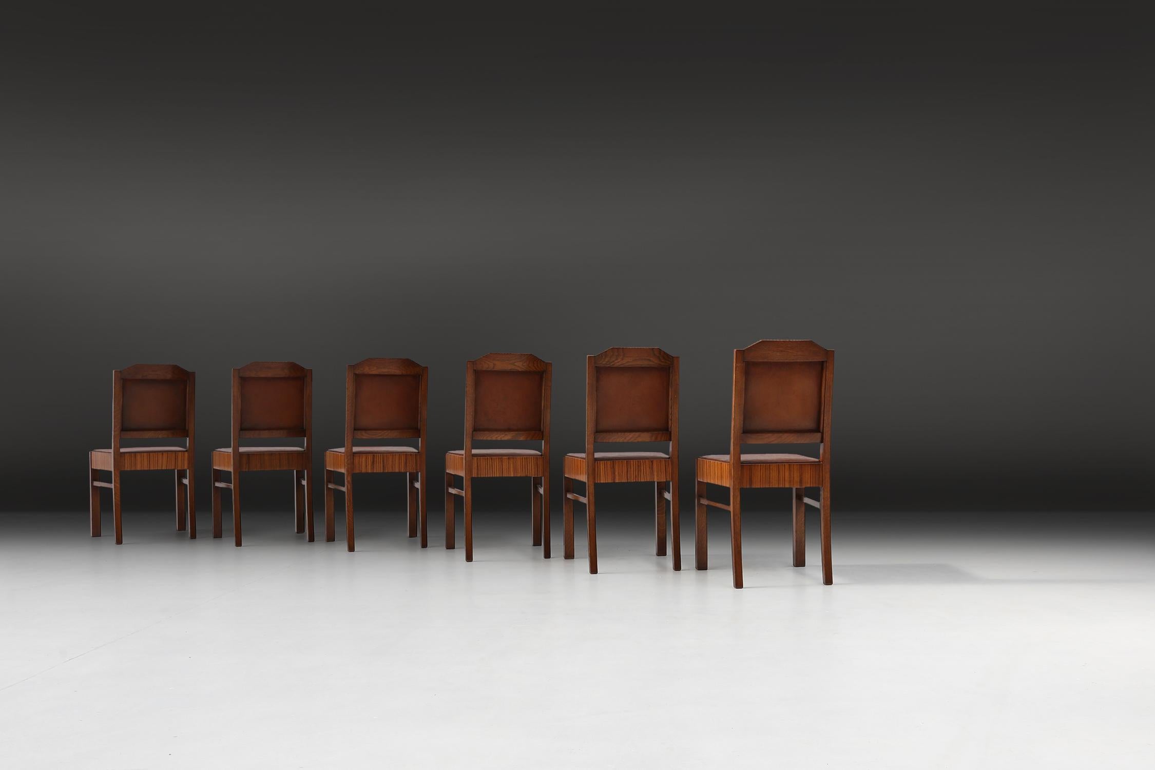 These stunning Art Deco chairs from the renowned De Coene brand are a true work of art. Made with attention to detail and craftsmanship, these chairs exude elegance and style.

The seats and backs are made of brown leather, which is soft and