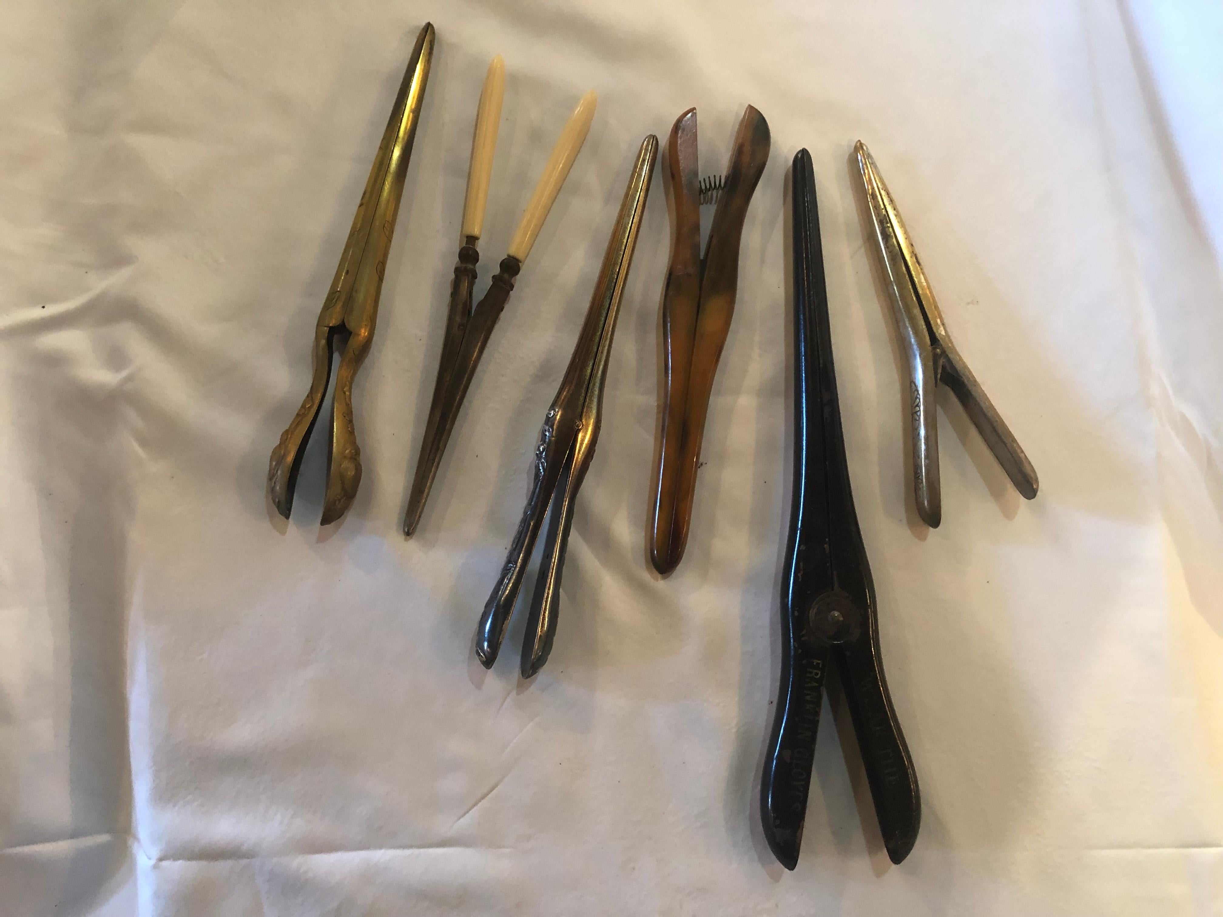 A fine group six custom designed collectible assorted metal and one Bakelite antique glove stretchers all having spring action. Some Engraved, signed and labeled Franklin Glove Company. Largest measures 11 inches. Smallest at 6.50 inches. Would look