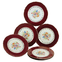 Six Atlas Burgundy & Gilt Rim China Dinner Plates with Floral Well