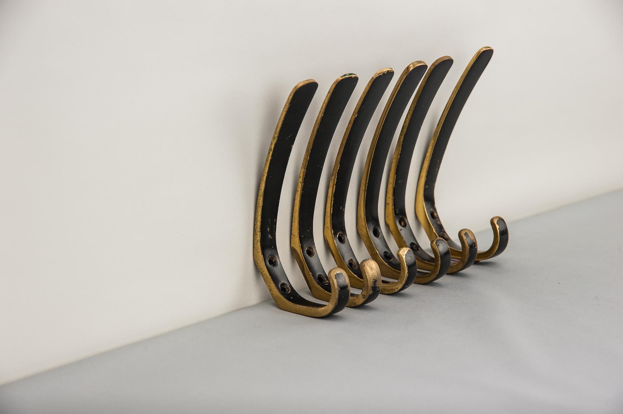 Six Austrian brass wall hooks by Hertha Baller
Original condition
Priced and sold per piece.
 