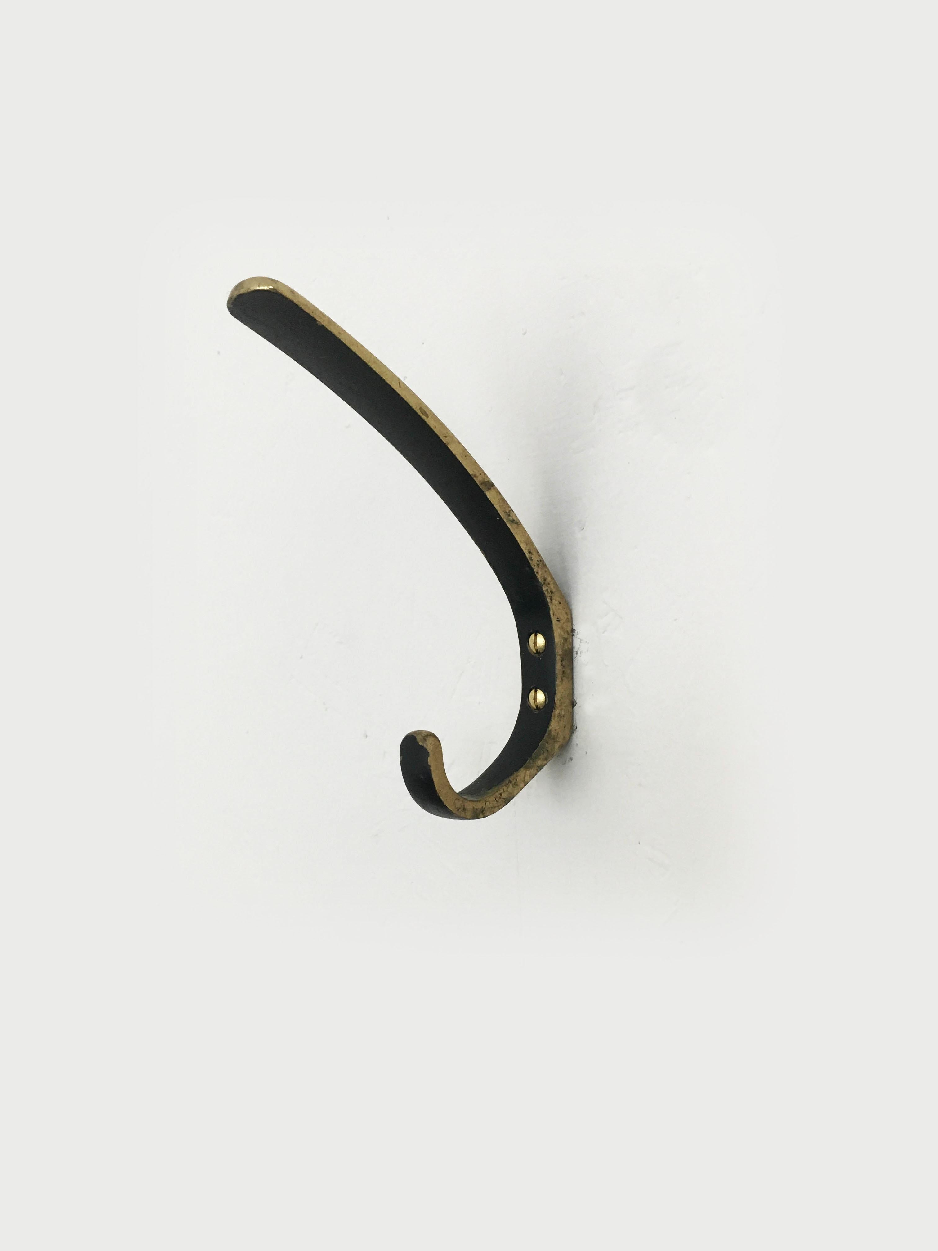 A set of six beautiful Austrian brass wall hooks, made of solid black-finished brass, partly polished, executed in the 1950s by Hertha Baller, Austria. In good condition, with nice patina. Priced as a set of six.