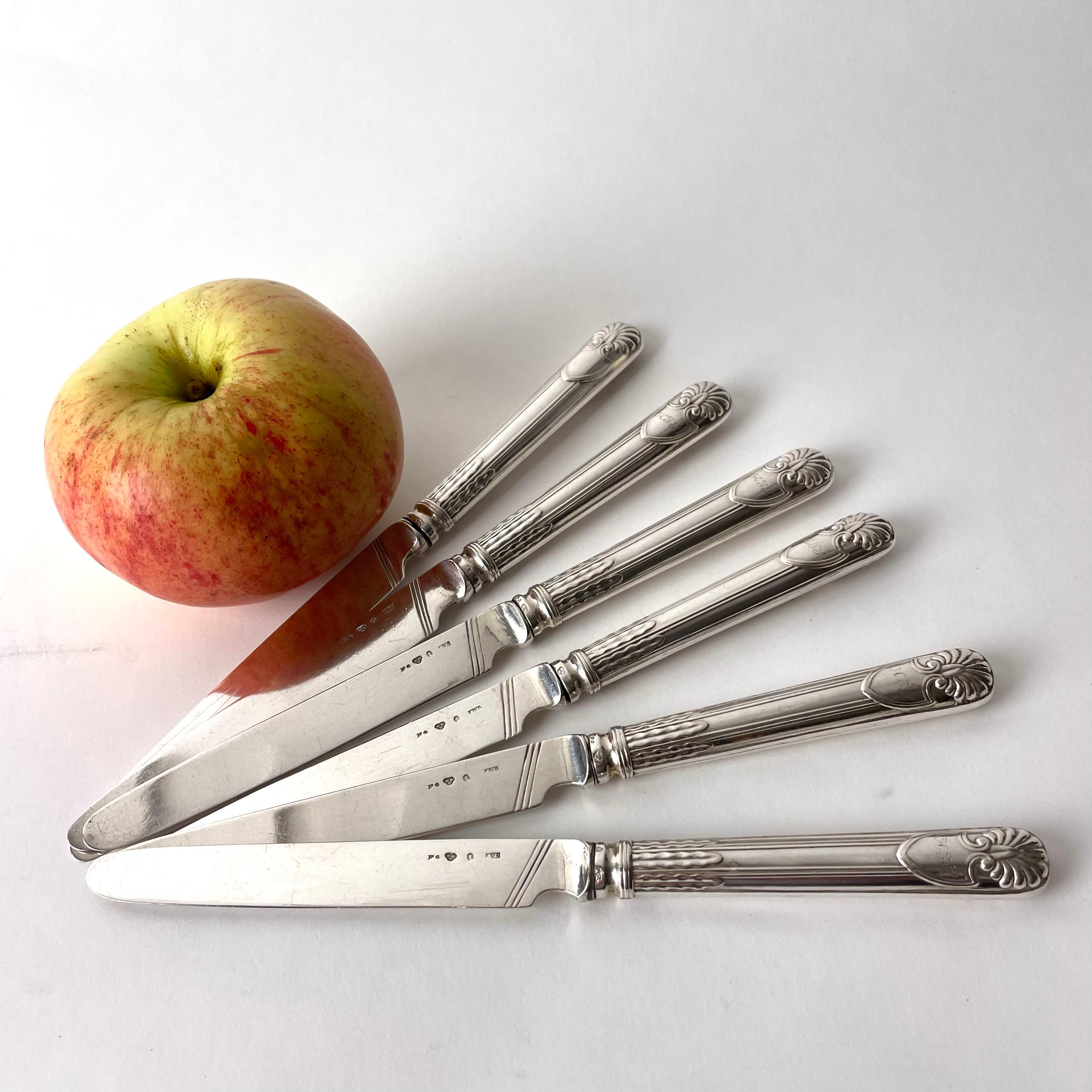 Six beautiful Fruit Knives in Silver by the famous silversmith Adolf Zethelius from Stockholm, Sweden. The knives are control stamped and marked F4 which means they were made in 1836.

Beautiful decor of shell, shield and leaf ornaments. One side of