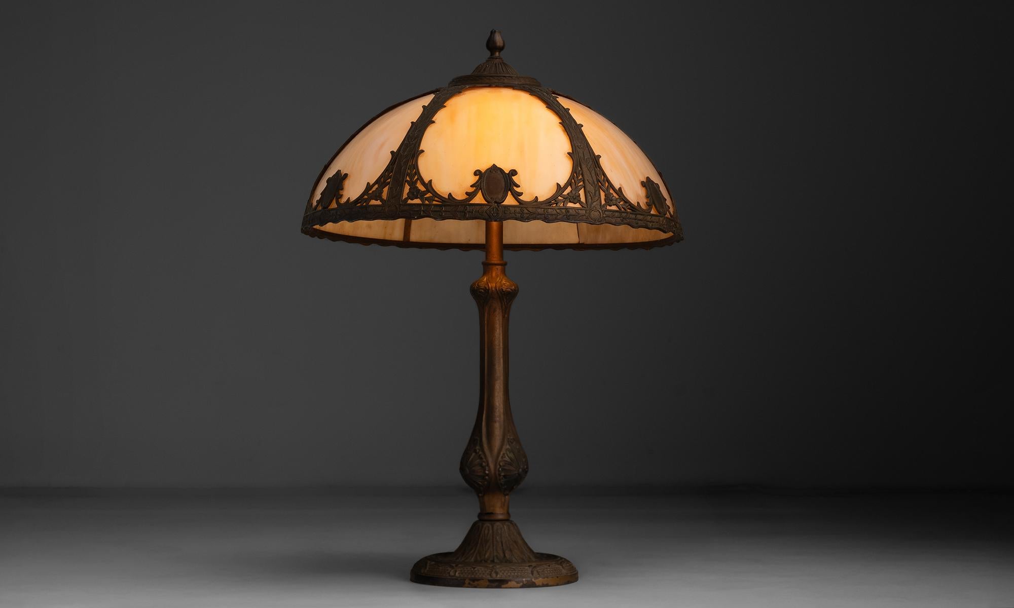 America, 1920
Ornate brass and stained glass art nouveau table lamp.
16.5”dia x 23”h
Ref. L1133
$ 1,400