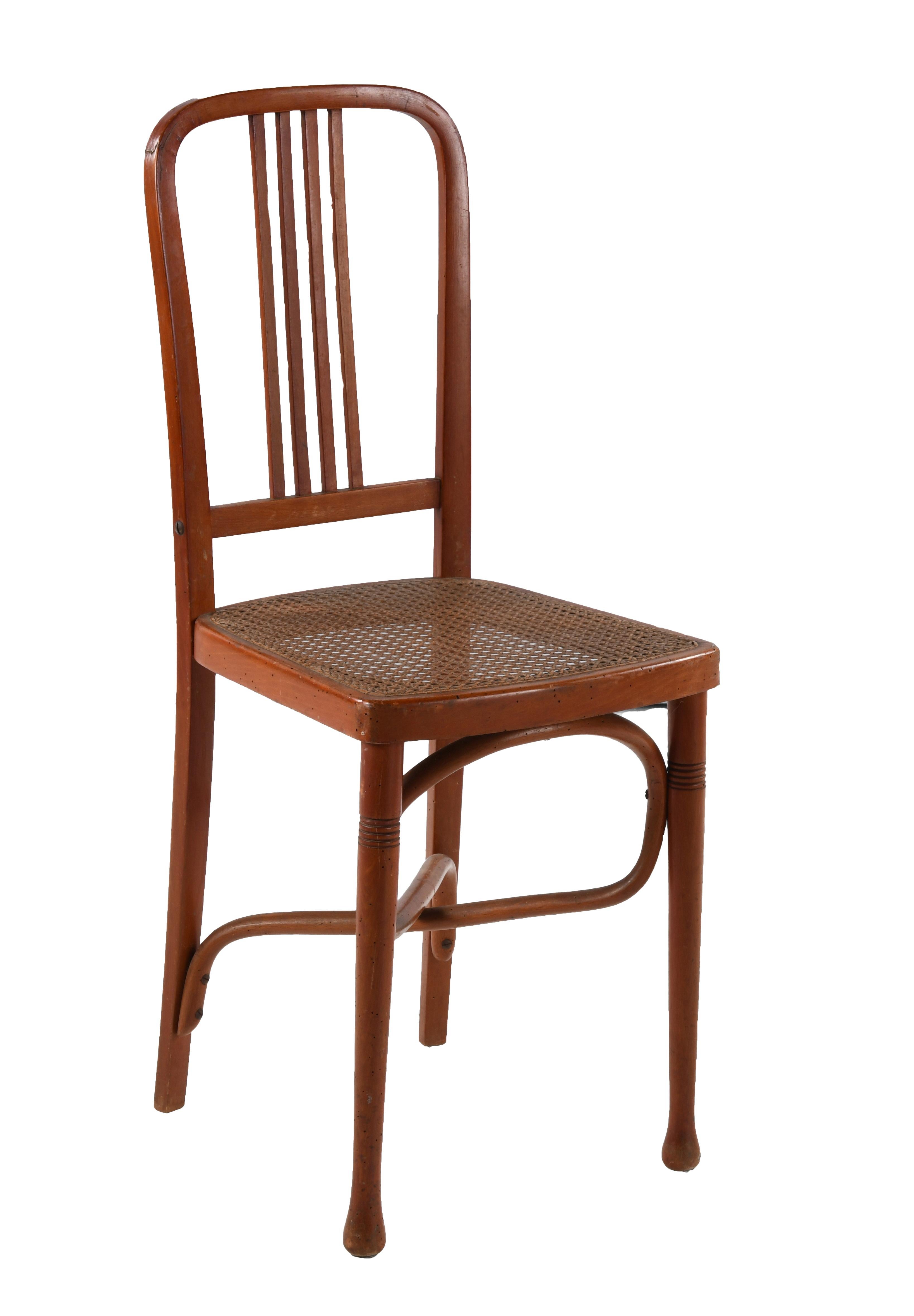 Set of six chairs in curved and stained beech wood in the Thonet or Kohn style. The seats are cane and in good condition. The backrest and seat structure are made from a single piece of wood that has been curved. The crossbars under the seat also