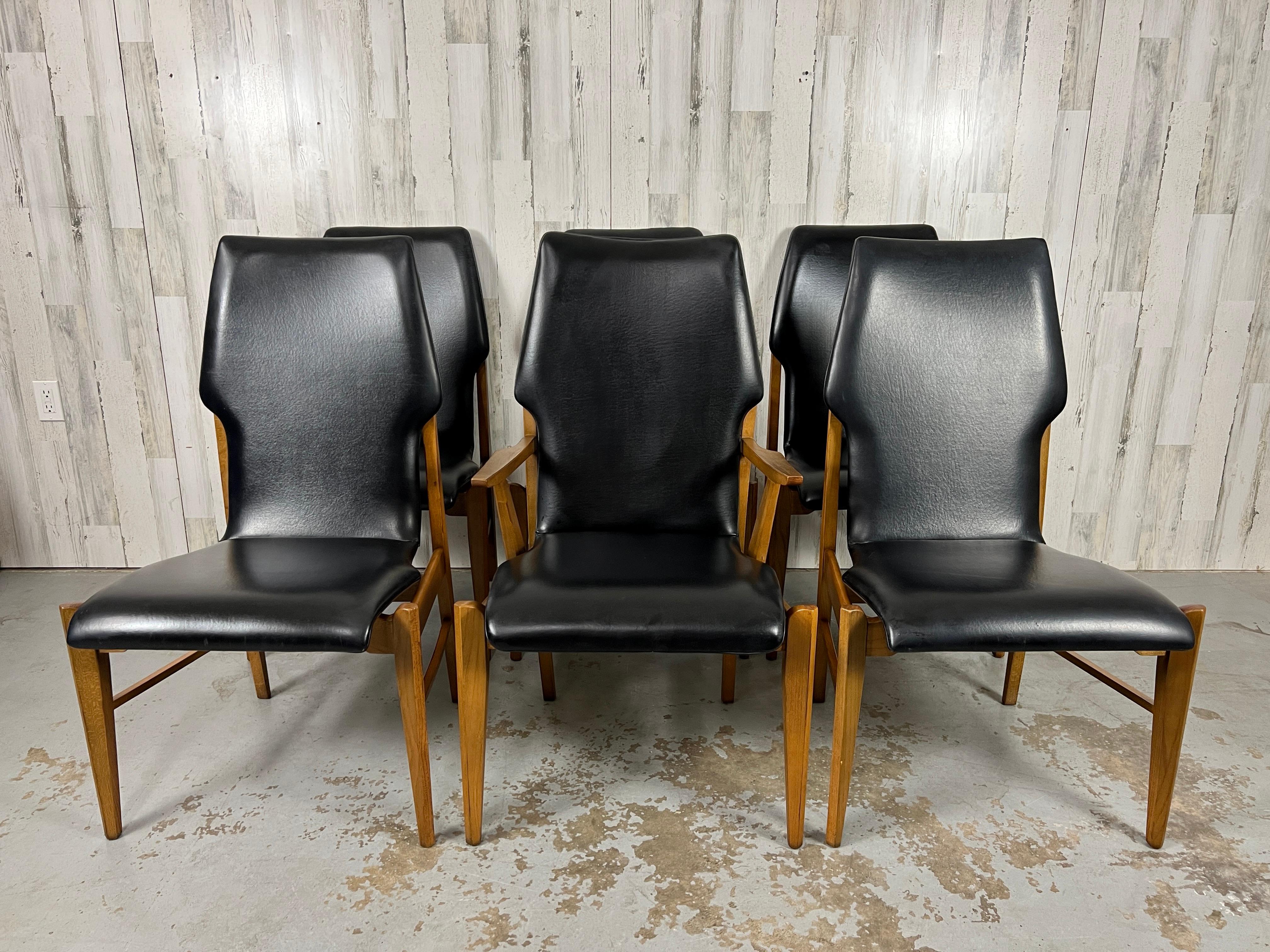 One arm chair and five side chairs complete this set of six . Bent walnut plywood with architechual wood frames. This set retains its original black vinyl cushions Made by Lane furniture company. 

Arm Chair measures 24 deep 22 5/8 wide 38.5 height