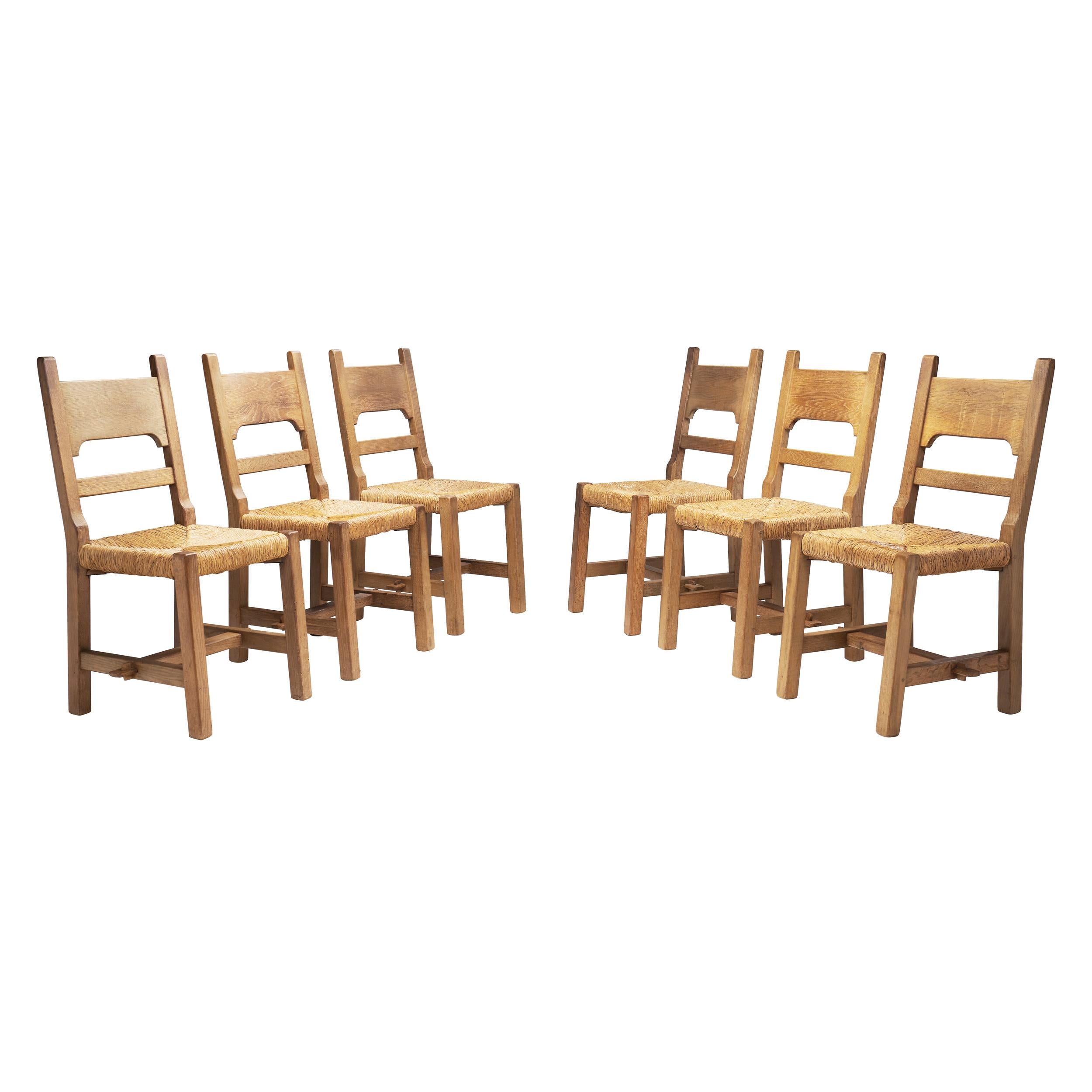 Six Brutalist Dining Chairs with Rush Seats, Europe ca 1960s For Sale