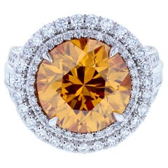 Six Carat Fancy Deep Orange Yellow Diamond Ring with Triple Shank & Diamond Pave